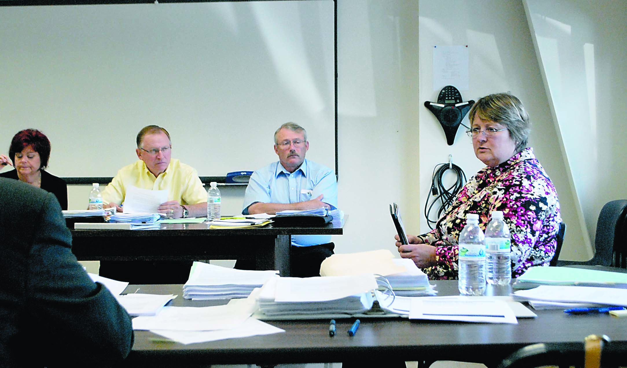 Clallam County Auditor Patty Rosand testifies Wednesday before a state Department of Licensing dispute review panel in Port Angeles. Listening to her response to questioning from county Chief Deputy Prosecuting Attorney Mark Nichols are panelists