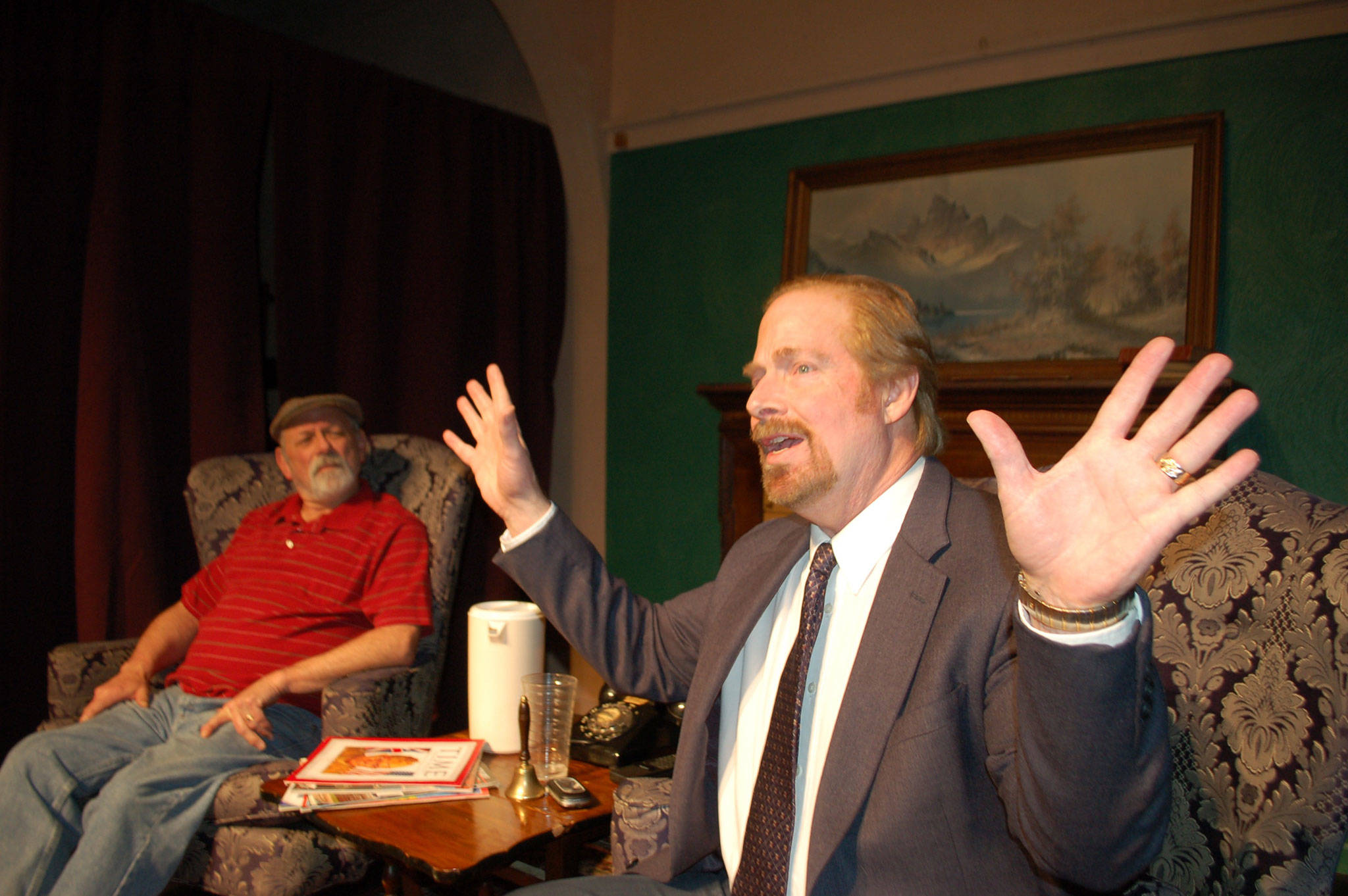 Jim Hallett cast as Mitch Albom, right, acts out an animated scene with Joe Schulz, playing the role of Morrie Schwartz, in the upcoming play “Tuesdays with Morrie.” (Erin Hawkins/Olympic Peninsula News Group)