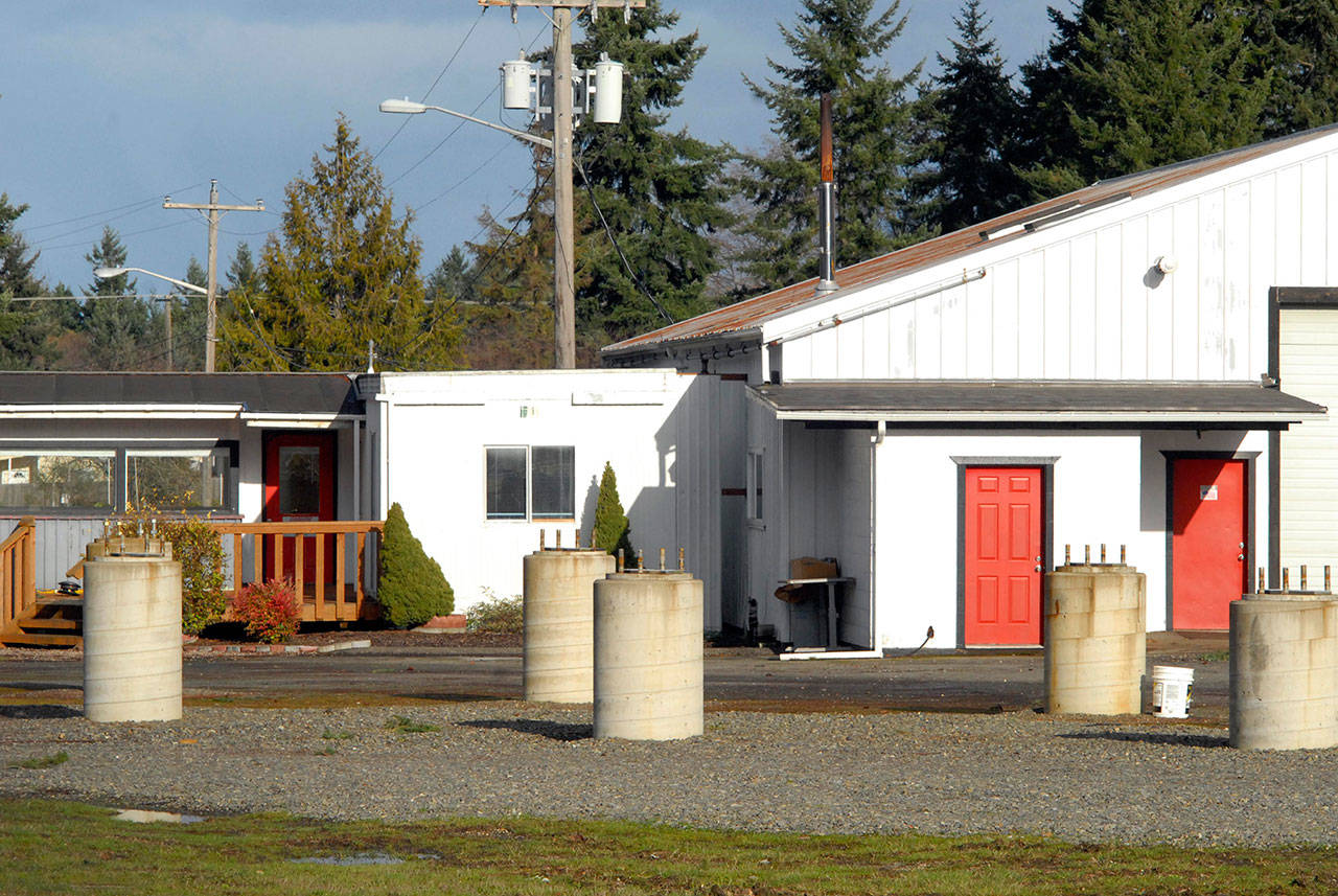 Concrete pilings that once supported a magnetic levitation demonstration track stand empty Tuesday behind the vacated shops of Lev-X in the Port Angeles Business Park. (Keith Thorpe/Peninsula Daily News)