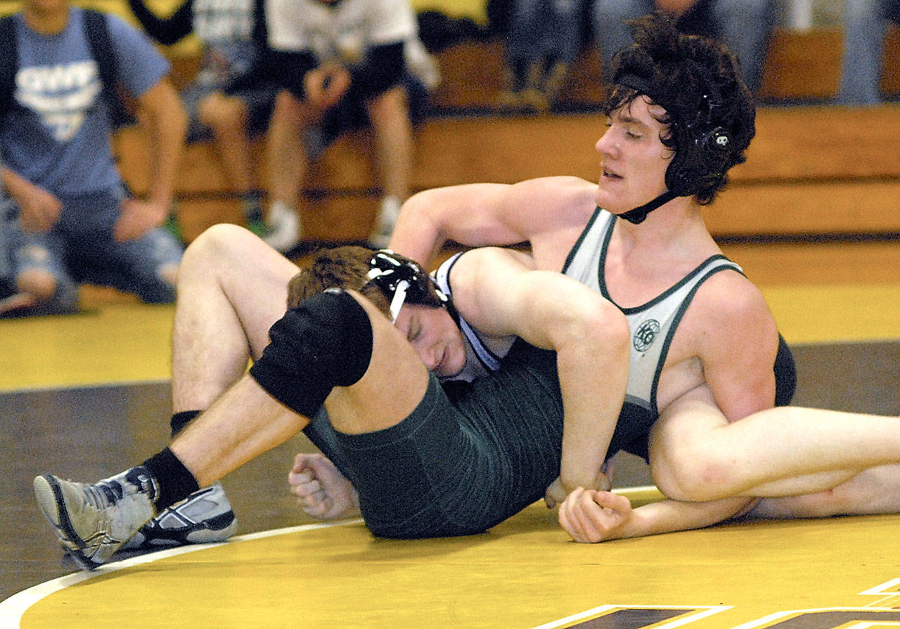 Keith Thorpe/Peninsula Daily News Seth Mann of Port Angeles, right, wrestles Daniel Pulley of North Mason in the 160-lb. class on Saturday at Port Angeles High School.