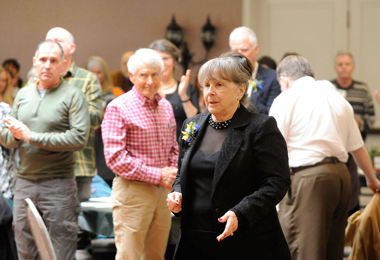 Judy Reandeau Stipe goes to accept the Sequim-Dungeness Valley Chamber of Commerce 2017 Citizen of the Year award on Tuesday. (Michael Dashiell/Olympic Peninsula News Group)