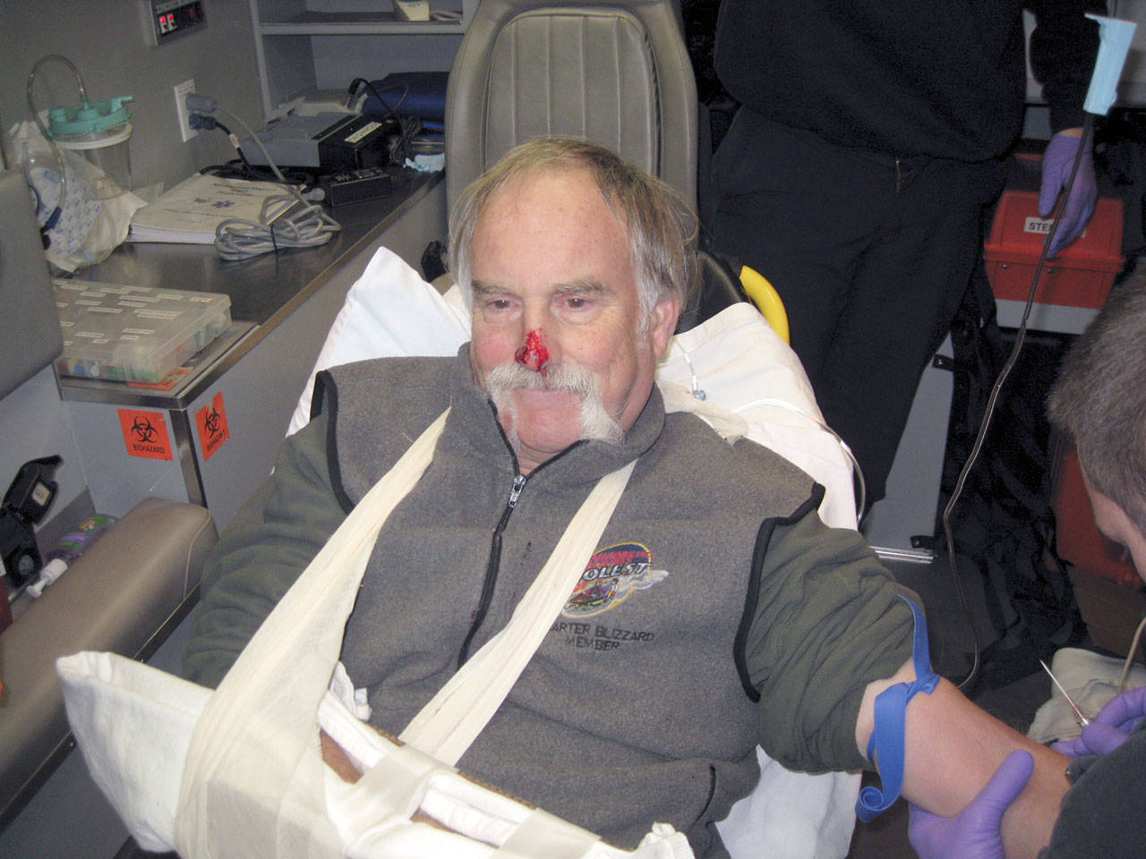 A medic treats Stephen Patch for a broken wrist and nose on Dec. 2, 2014, according to the Port Townsend Police Department. (Port Townsend Police Department)