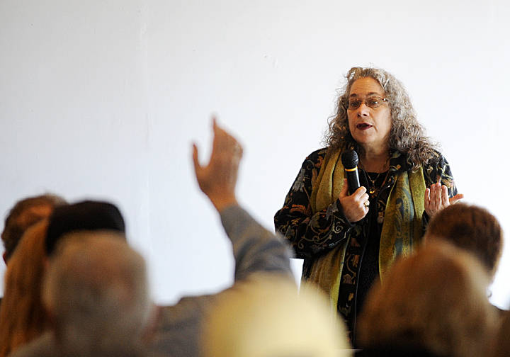 Karen Goschen, Port of Port Angeles Executive Director, talks about a public process to consider a developer’s interest in purchasing the John Wayne Marina at a meeting at the marina. Michael Dashiell/Olympic Penisula News Group