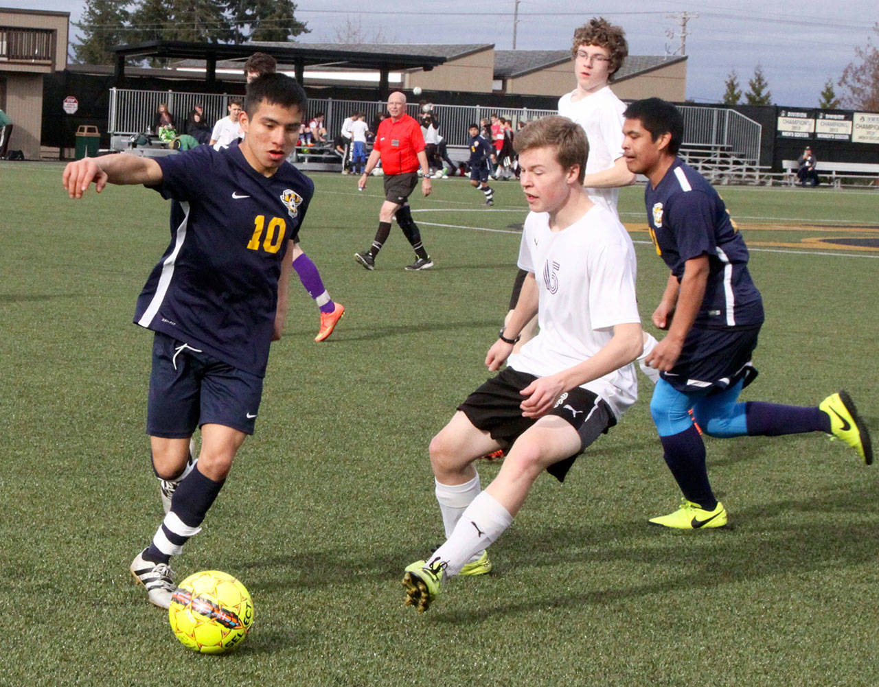 Samuel Gomez (10) of Forks tries to keep control of the ball away from Jordan Hurdlow (15) of the Sequim JV. Forks won 5-0 to remain undefeated on the season. The Spartans also have not given up a goal this season. (Dave Logan/for Peninsula Daily News)