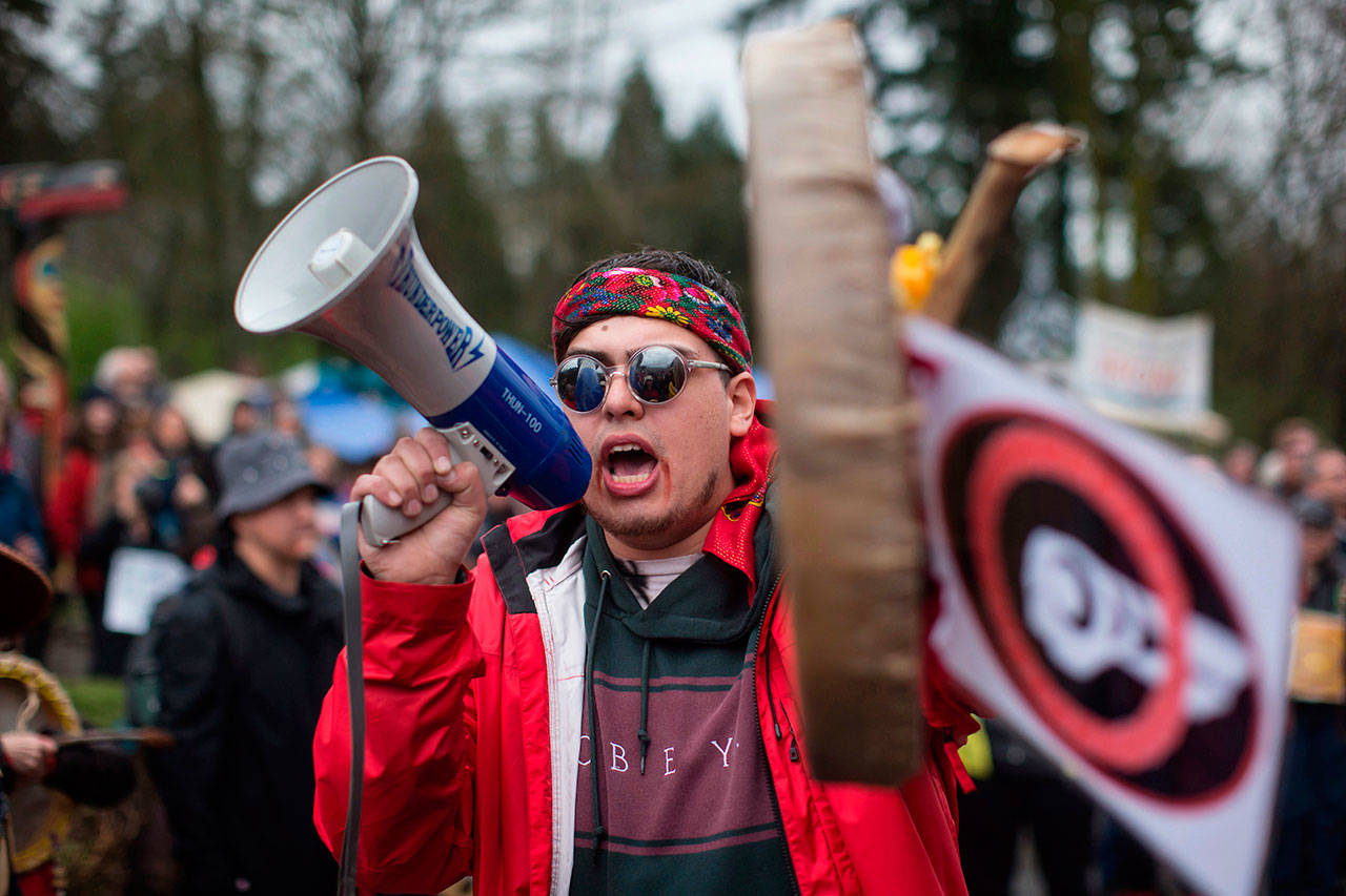 Cedar George-Parker addresses the crowd of protesters opposed to Kinder Morgan’s plan on Trans Mountain pipeline extension Saturday in Burnaby, B.C. (Darryl Dyck/The Canadian Press via AP)