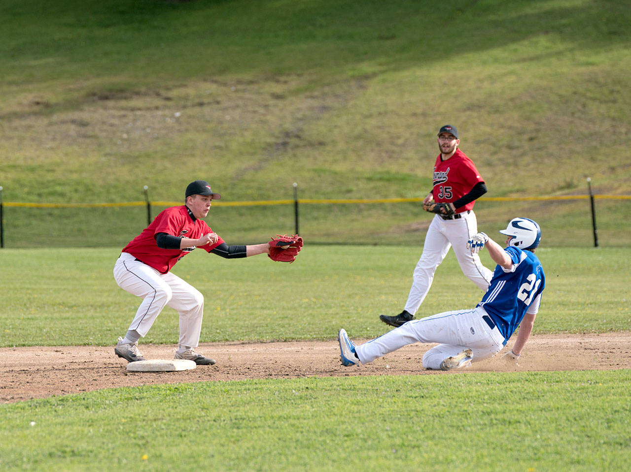 Port Townsend’s Payton Lake has the ball in glove but misses the tag at second on Chimacum’s Jonah Deihl in Monday afternoon baseball action in Port Townsend.                                Steve Mullensky/for Peninsula Daily News                                Steve Mullensky/for Peninsula Daily News Port Townsend’s Payton Lake has the ball in glove but misses the tag at second on Chimacum’s Jonah Deihl in Monday afternoon baseball action in Port Townsend.