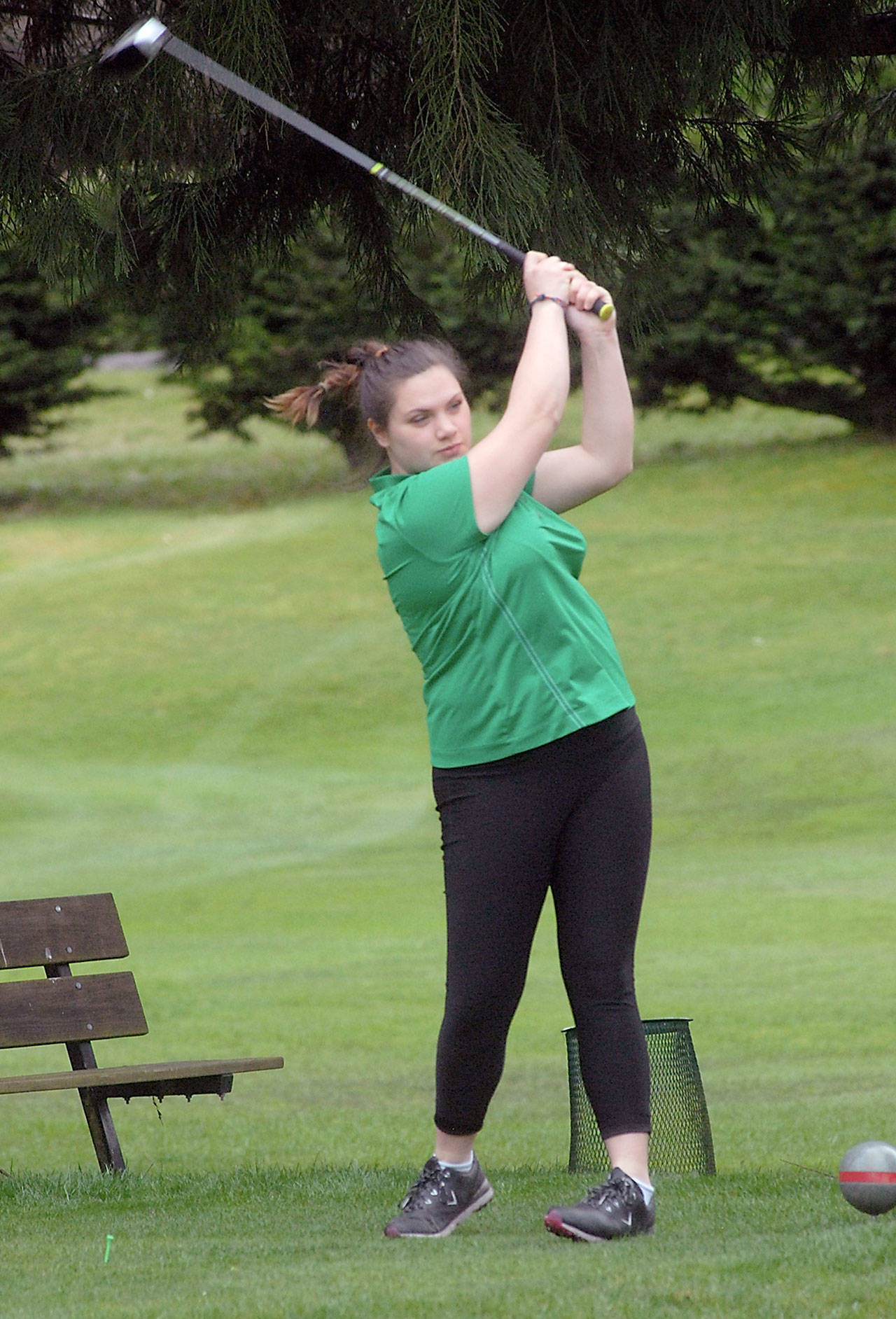 Keith Thorpe/Peninsula Daily News Gillian Elofson of Port Angeles tees off on the first hole on Wednesday at Peninsula Golf Course in Port Angeles.