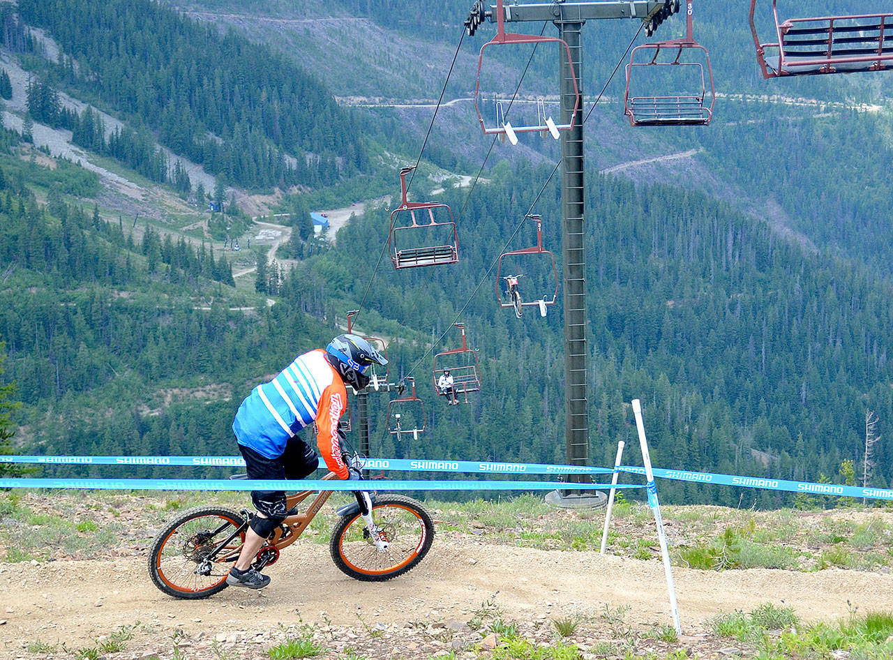 Ron Riggs of Port Angeles rides in the fourth leg of the Northwest Cup downhill mountain-biking races in Kellogg, Idaho, this weekend. Riggs finished third in the men’s Cat 3 40+ division.