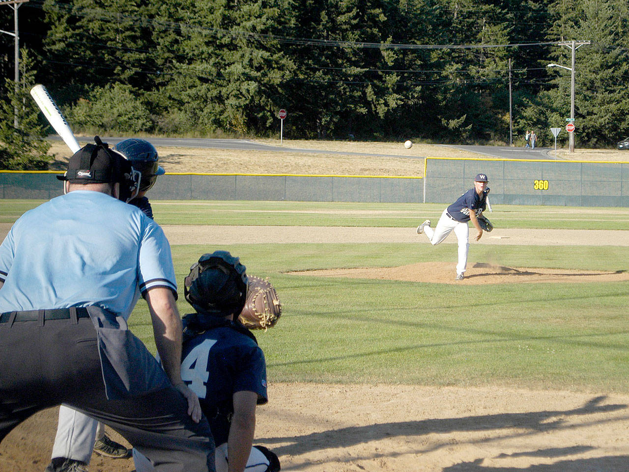 Wilder Junior pitcher Tate Gahimer delivers to a Ridge AA batter in Wilder’s 20-1 win Monday at Volunteer Park. Gahimer gave up just one run in three innings. With the win, Wilder Junior won the NW Area 2 AA league championship. (Pierre LaBossiere/Peninsula Daily News)