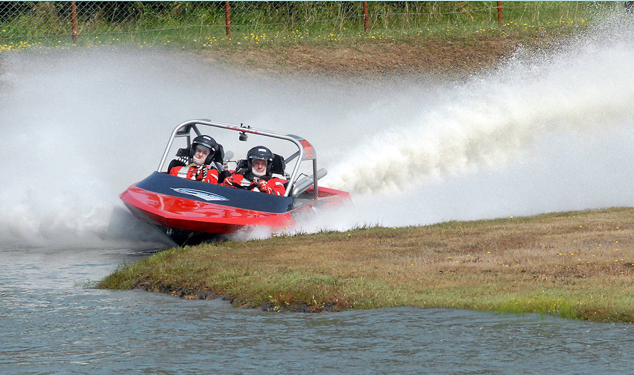 Keith Thorpe/Peninsula Daily News The Badfish team of driver Scott Jensen, right, and navigator Brittan Jensen took top honors in the modified class during Saturday’s sprint boat races at Extreme Sports Park in Port Angeles.