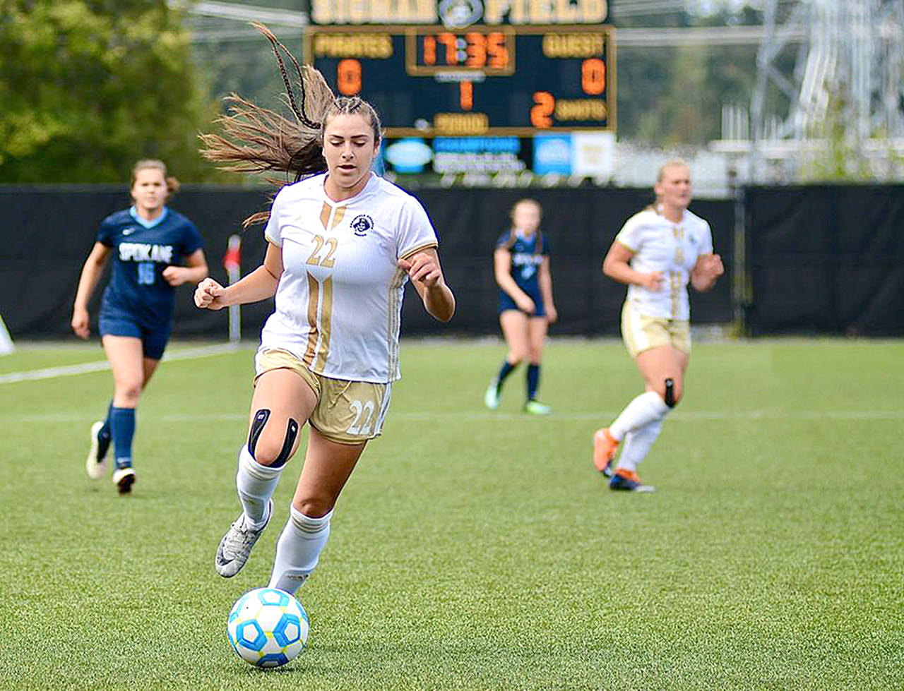 Jay Cline                                Peninsula’s Sam Guzman dribbles upfield during the Pirates’ 2-0 win over Spokane on Saturday at Wally Sigmar Field.