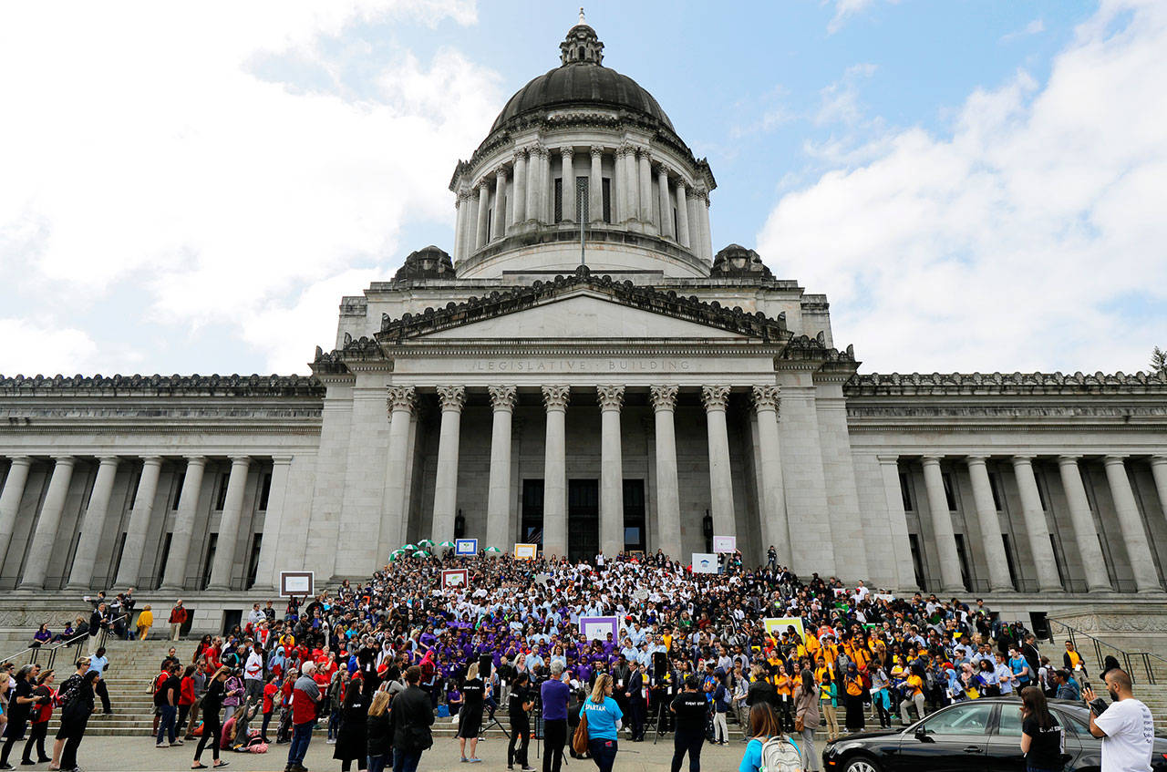 In this May 17 file photo hundreds of charter school students, teachers and supporters rally at the Capitol in Olympia. (The Associated Press)