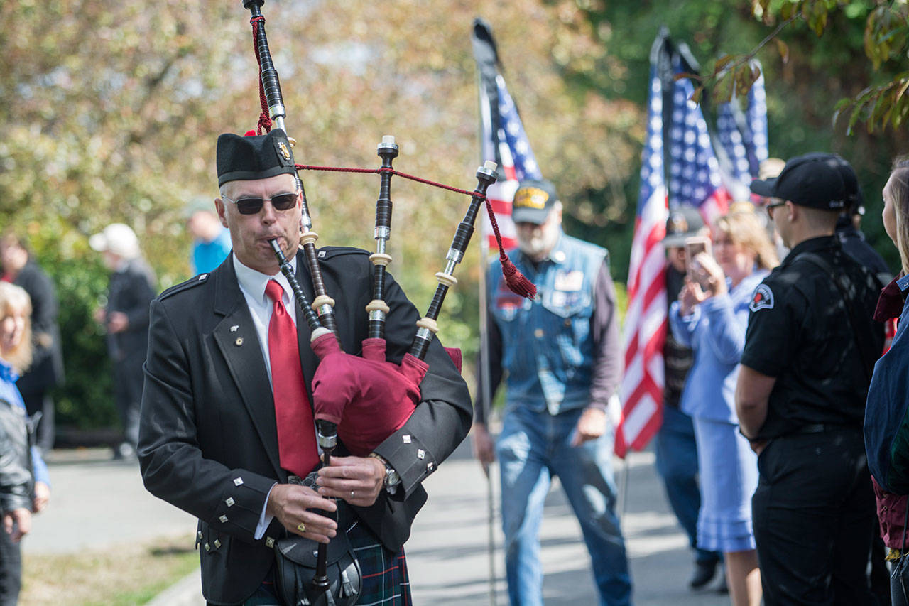 Retired Coast Guardsman Rick McKenzie performs “Amazing Grace” at the conclusion of the 9/11 ceremony Tuesday afternoon. (Jesse Major/Peninsula Daily News)