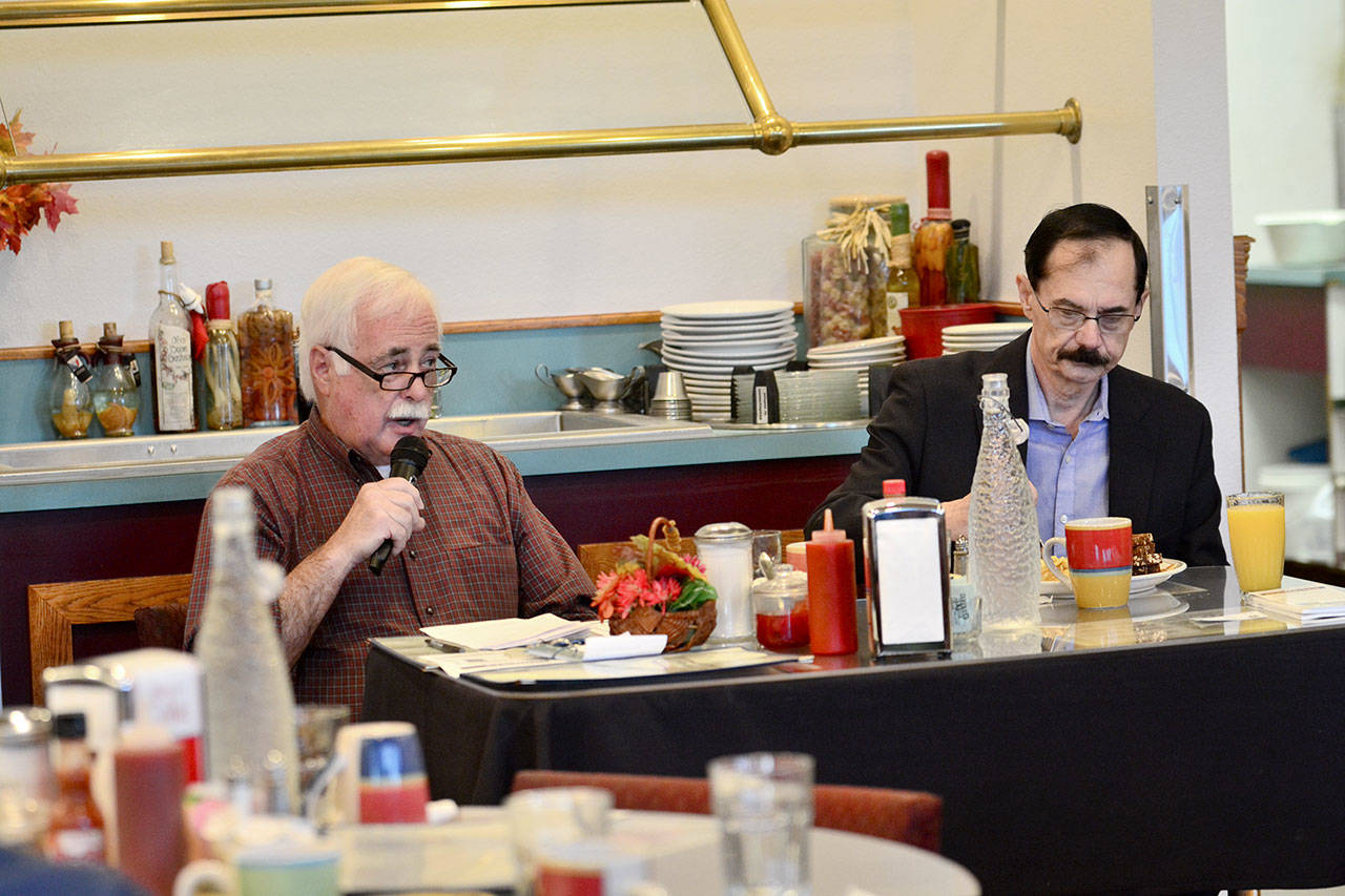 Democrat Mike Doherty, left, and Republican incumbent Bill Peach debate in a Port Angeles Business Association candidate forum Tuesday. The two are competing for the District 3 seat on the Clallam County Board of Commissioners. (Jesse Major/Peninsula Daily News)