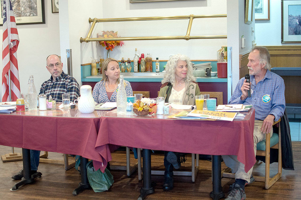 From left, Todd Myers, director of the Center for the Environment at the Washington Policy Center; Stephanie Celt, Washington state policy coordinator for BlueGreen Alliance; Diane Lombardo of Olympic Climate Action; and Ed Bowlby of Olympic Climate Action, discuss Initiative 1631 during a Port Angeles Business Association Forum in Port Angeles on Tuesday. (Jesse Major/Peninsula Daily News)