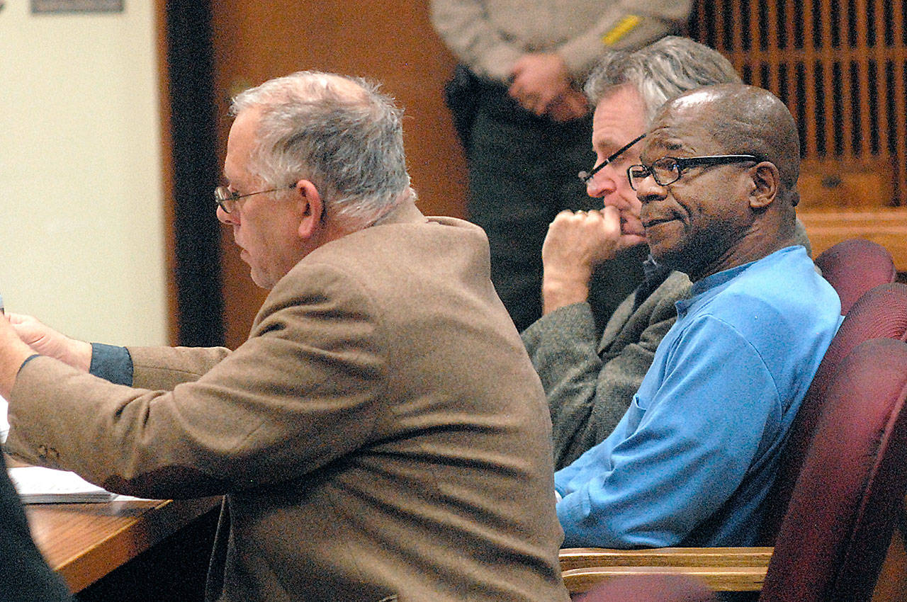 Tommy Ross Jr., right, sits with attorneys Harry Gasnick, left, and John Hayden during an appearance in Clallam County Superior Court. (Keith Thorpe/Peninsula Daily News)