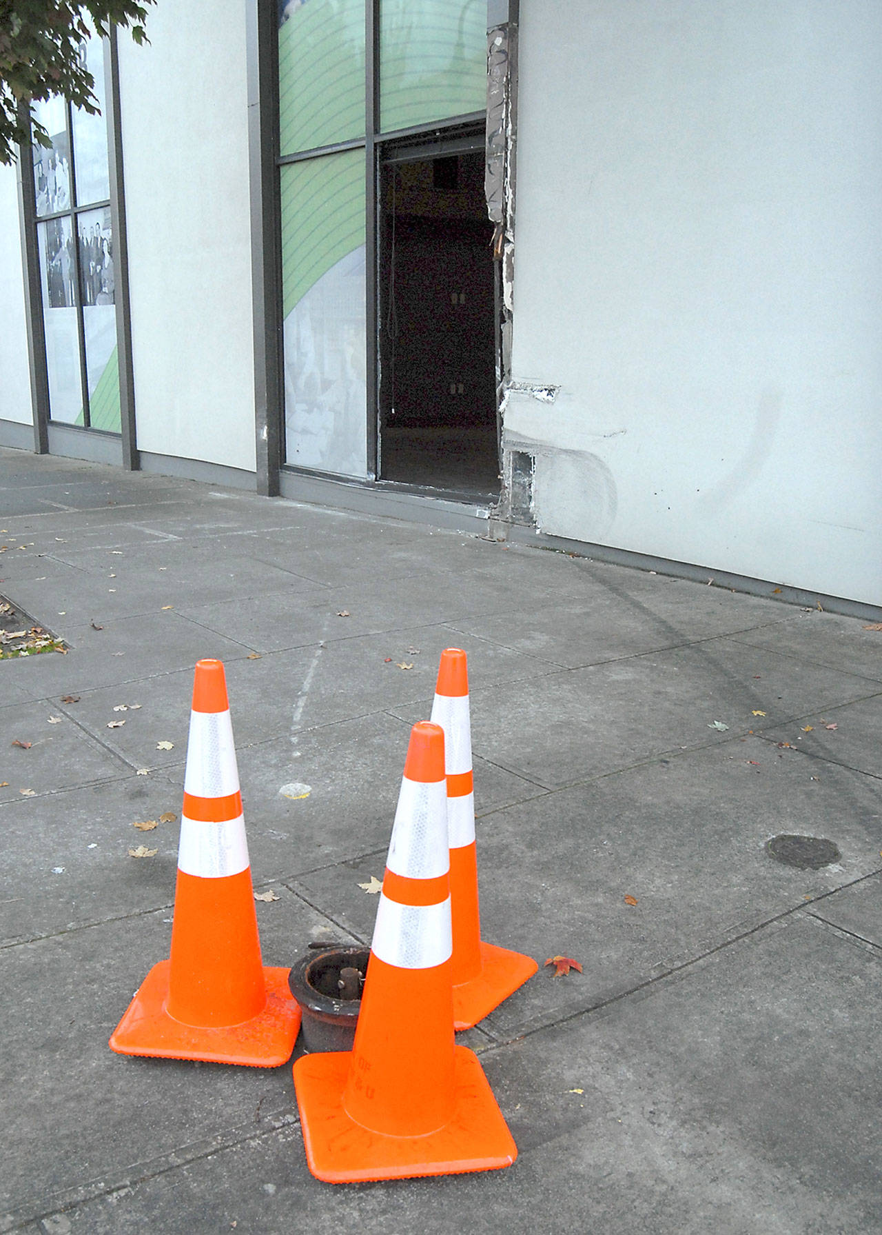 Traffic cones mark a sheared-off fire hydrant near the site where a vehicle struck the side of First Federal at First and Oak streets in downtown Port Angeles early Thursday morning. (Keith Thorpe/Peninsula Daily News)