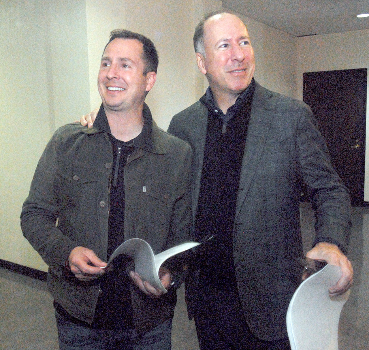 Incumbent Clallam County Prosecuting Attorney Mark Nichols, left, celebrates an election night lead with his brother, Rob Nichols, at the courthouse in Port Angeles. (Keith Thorpe/Peninsula Daily News)