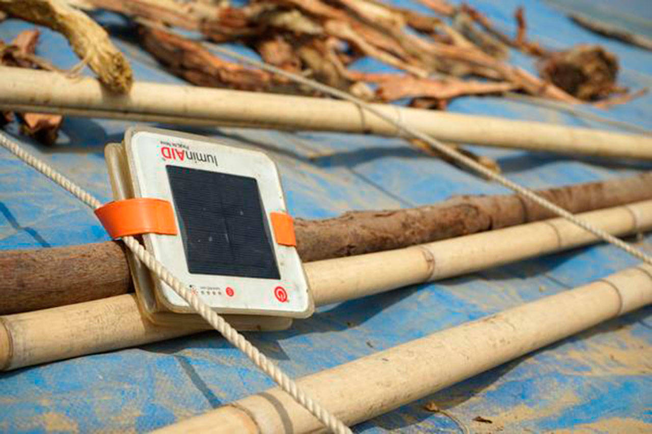 A LuminAID light charges on a ShelterBox tarpaulin roof in Bangladesh. (luminaid.com)