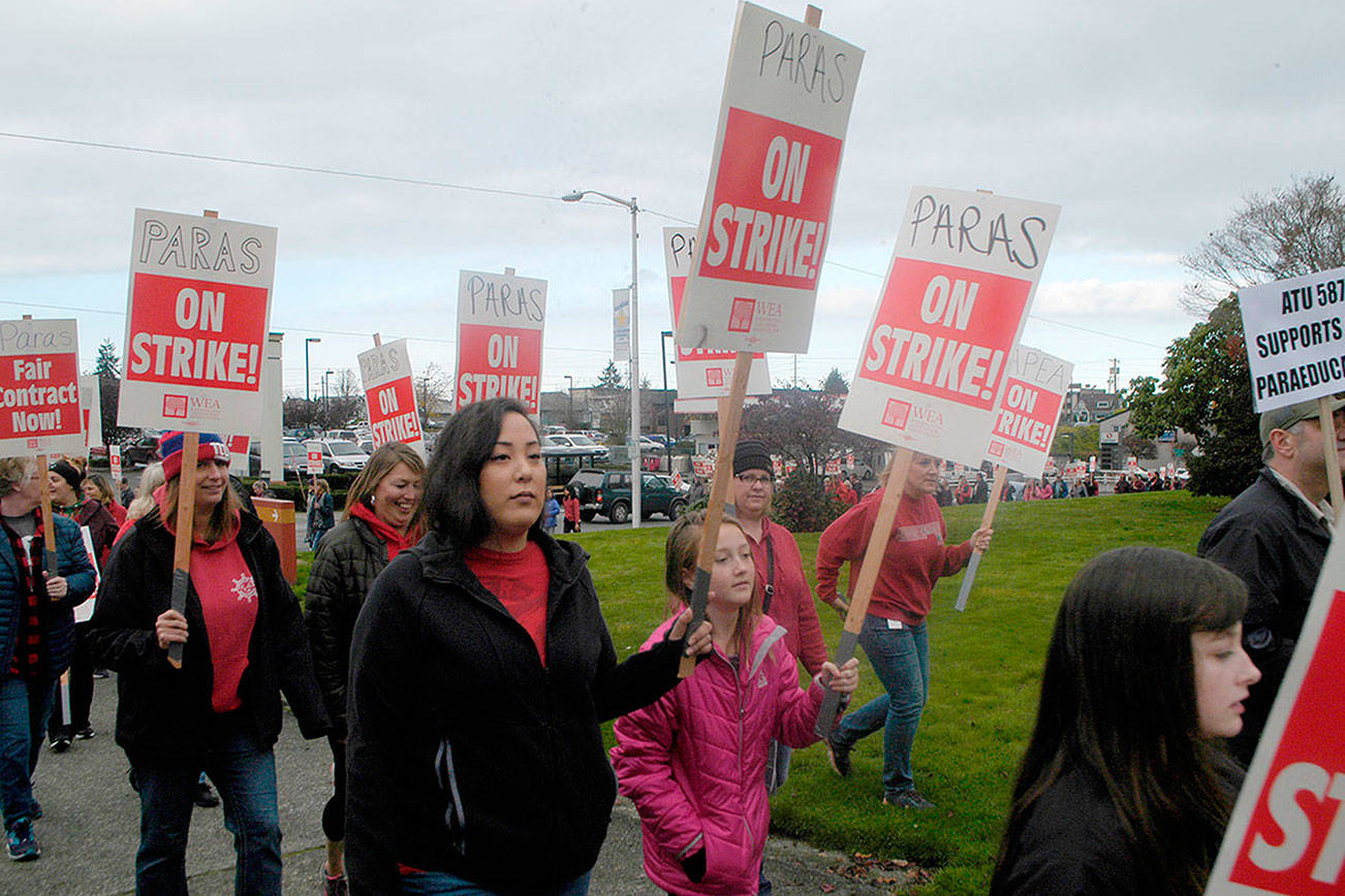 More than 150 teachers and paraeducators ended their demonstration in downtown Port Angeles, circling past the courthouse, supporting the paraeducators’ strike. (Paul Gottlieb/Peninsula Daily News)