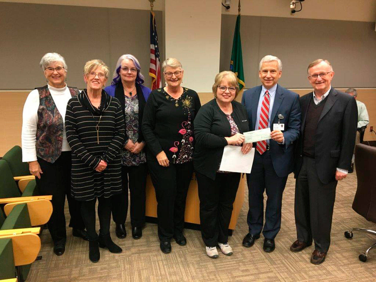 Olympic Medical Center hospital commissioners and OMC Foundation representatives recognize two Sequim groups that have donated funds to further cancer care expansion plans at OMC over recent years. From left, are Sequim residents Judy Kelley and Cheryl Coulter from the Sunland Drive for the Cure Golf Tournament, Joanne Eriksen and Linda Turner from the Sequim Mad Hatters’ Tea Committee, OMC Foundation Board member Karen Rogers, OMC CEO Eric Lewis and OMC Foundation Executive Director Bruce Skinner.