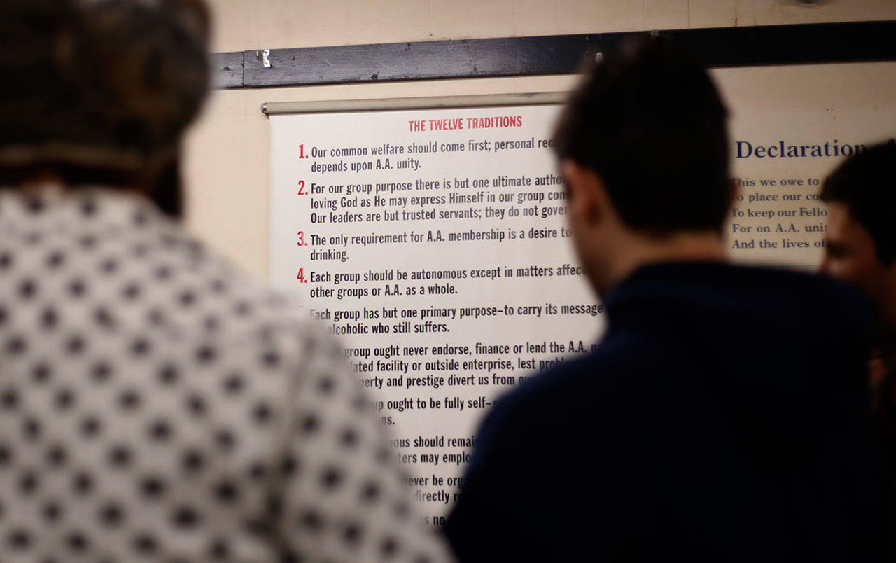 Young men gather to talk after a 12-step meeting for Internet & Tech Addiction Anonymous in Bellevue. (Martha Irvine/The Associated Press)