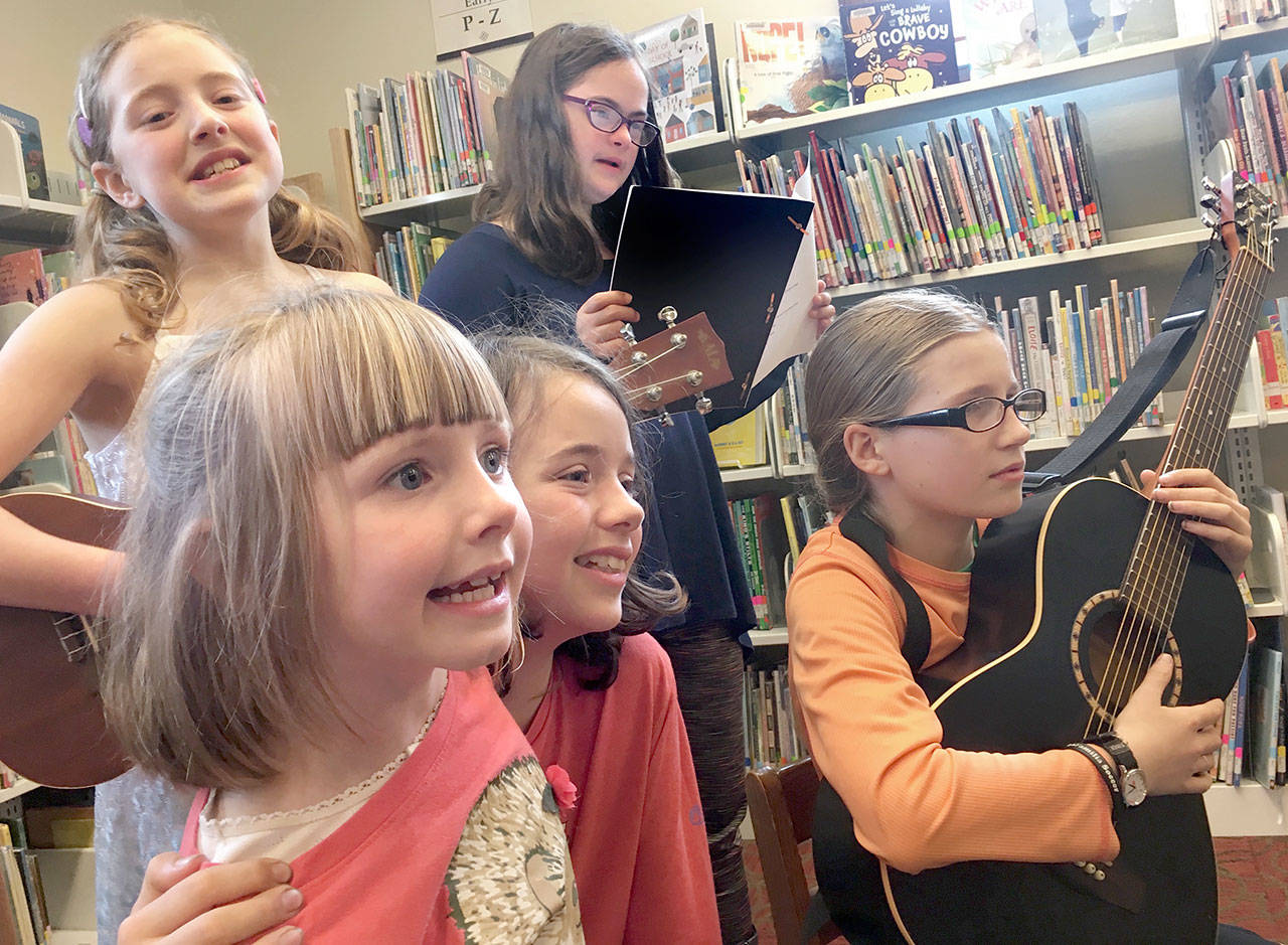 Jessa Northey, Lila Morgan, Charlotte Capel, Emma McAdam and Mariel Thomas are pictured at the Port Townsend Public Library. (Phina Pipia)