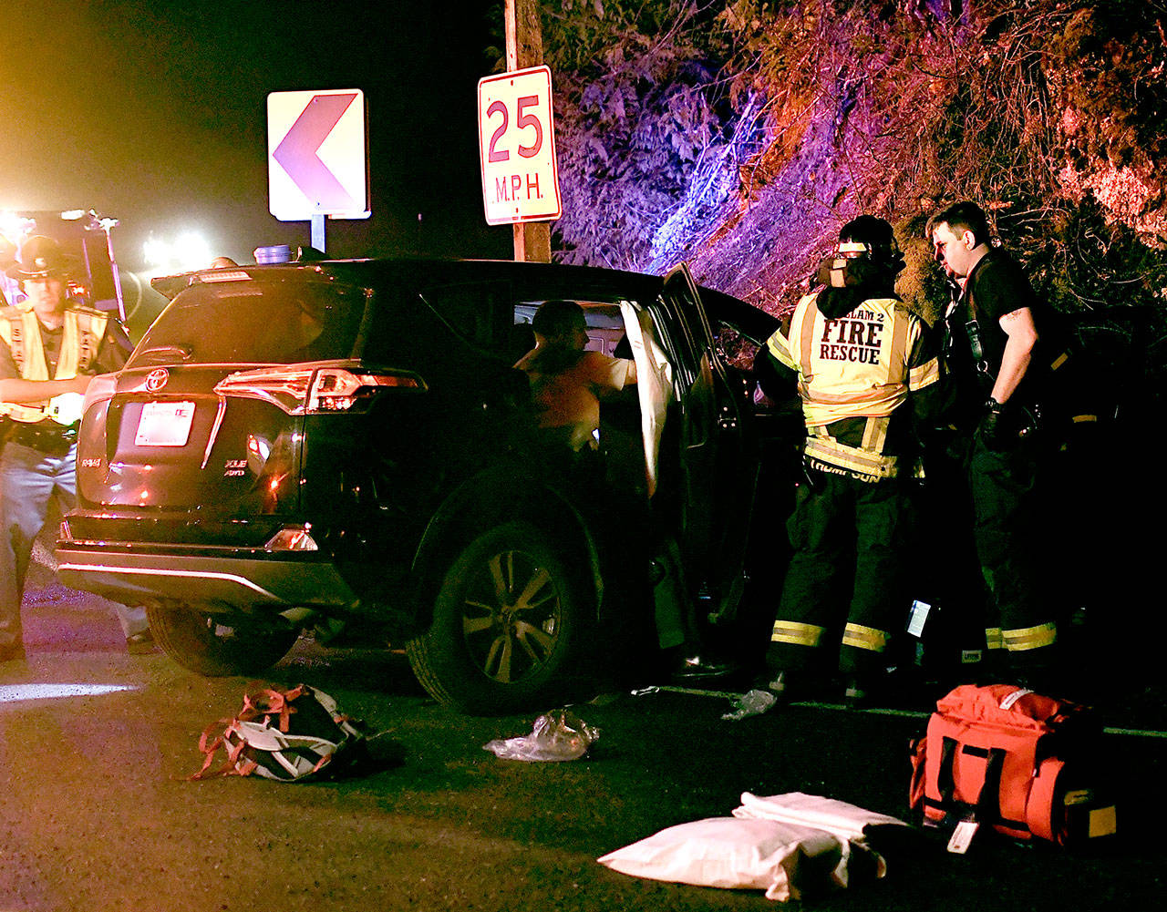 Three California women were injured when a driver missed the curve east of the Elwha River bridge on U.S. Highway 101 and rammed into an embankment. (Jay Cline/Clallam County Fire District 2)