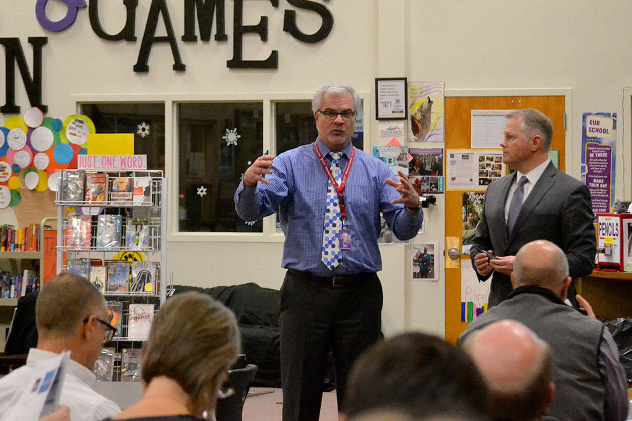 Sequim School Superintendent Gary Neal stands with Trevor Carlson, managing director of PiperJaffray, on Monday, during a forum for discussions on future construction needs and bond and levy options. (Matthew Nash/Olympic Peninsula News Group)