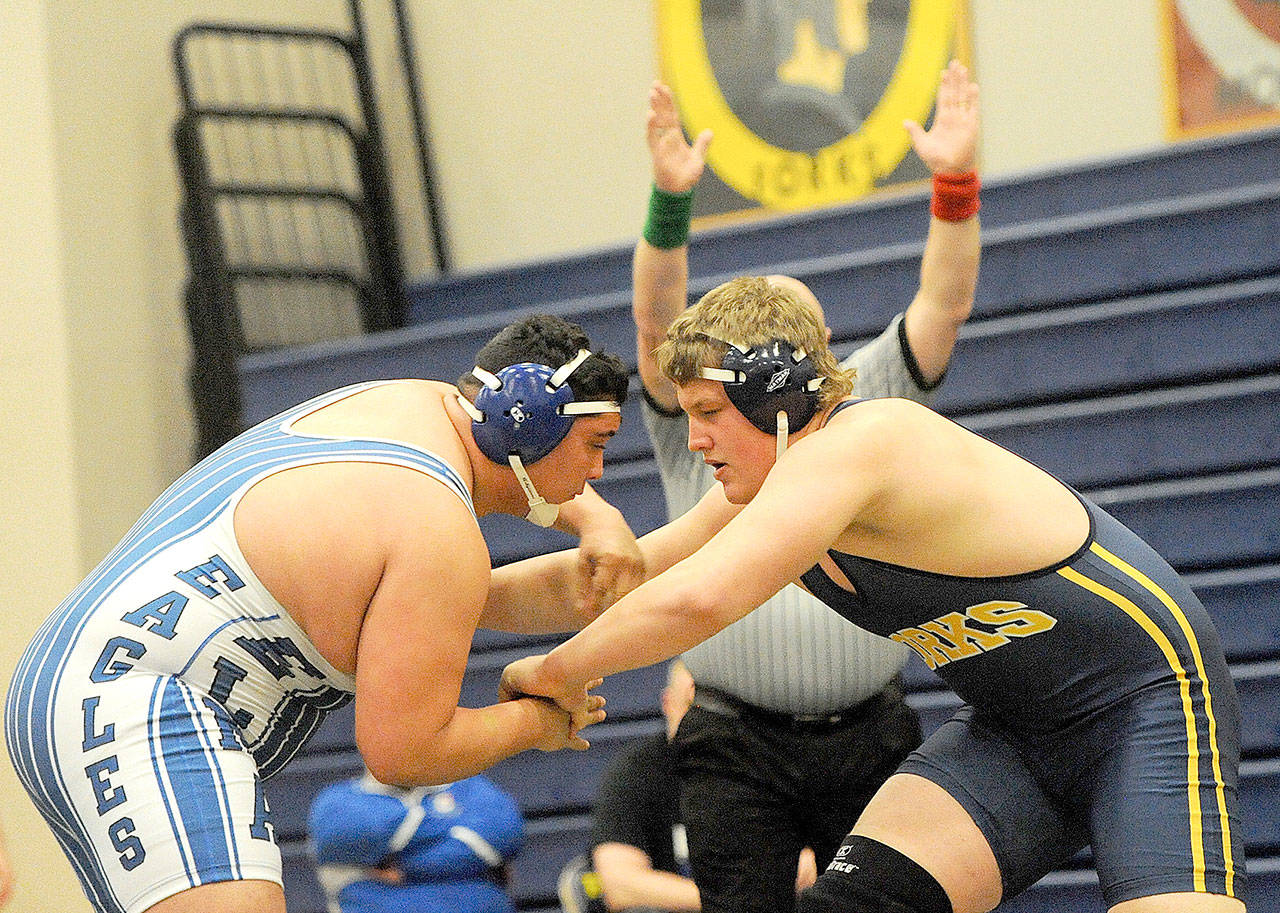 Lonnie Archibald/for Peninsula Daily News Luke Dahlgren, the 285 class 1A state champion, wrestles against Elma in an Evergreen 1A match earlier this season. Dahlgren won his state title after finishing fourth last year and after his brother Jack finished second twice at the Mat Classic.