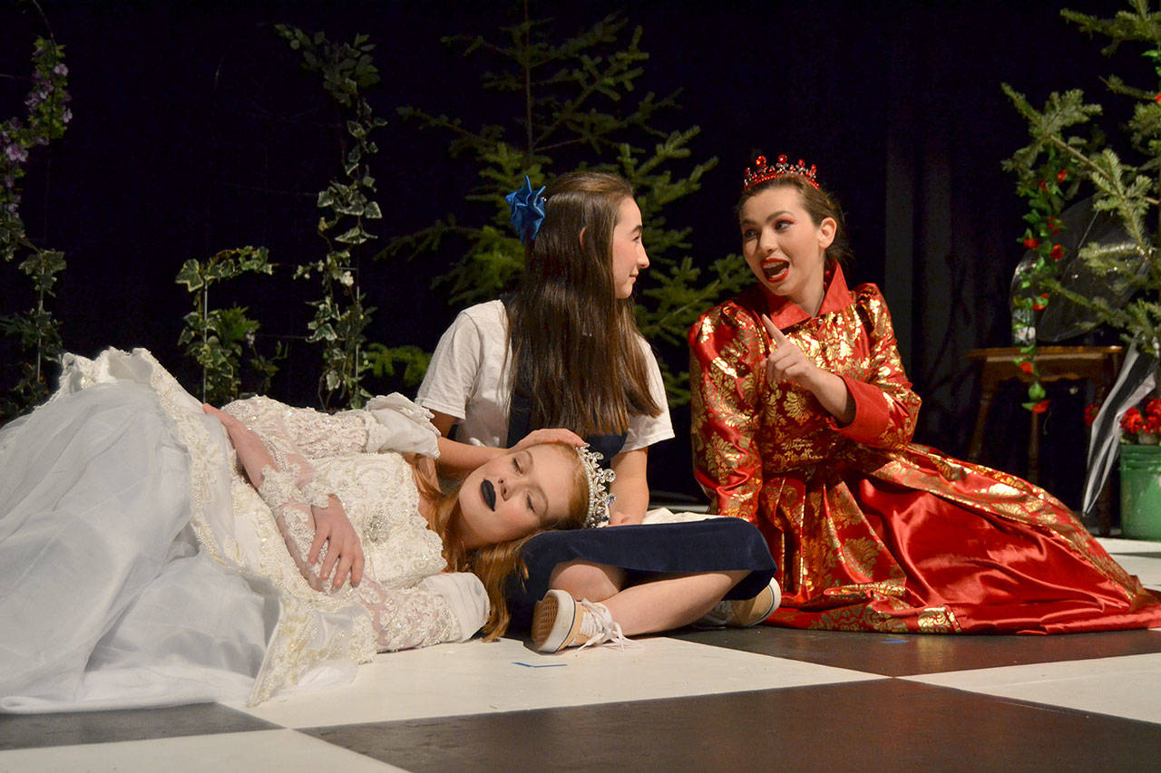 Alice (Kariya Johnson) converses with the Red Queen (Maggie van Dyken) just before the two queen opt to take a nap on her in “Through the Looking-Glass.” (Matthew Nash/Olympic Peninsula News Group)