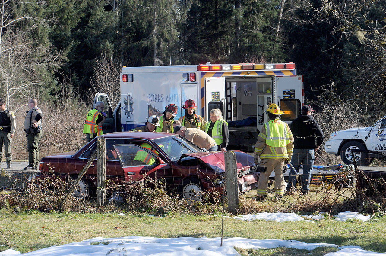 (Lonnie Archibald/For Peninsula Daily News)                                A two-car collision took place Friday at the junction of Highway 101 and Beaver Avenue north of Forks. A 91-year-old man was airlifted after transferring to the Forks hospital.