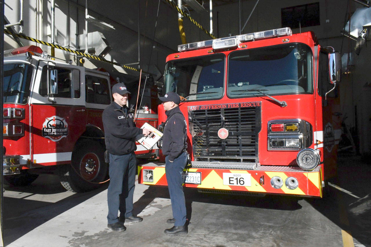 Firefighter EMT Scott Walker, left, and Firefighter EMT Scott Pulido were on duty Tuesday morning at East Jefferson Fire-Rescue Station 16 at 701 Harrison St. in Port Townsend. (Jeannie McMacken/Peninsula Daily News)