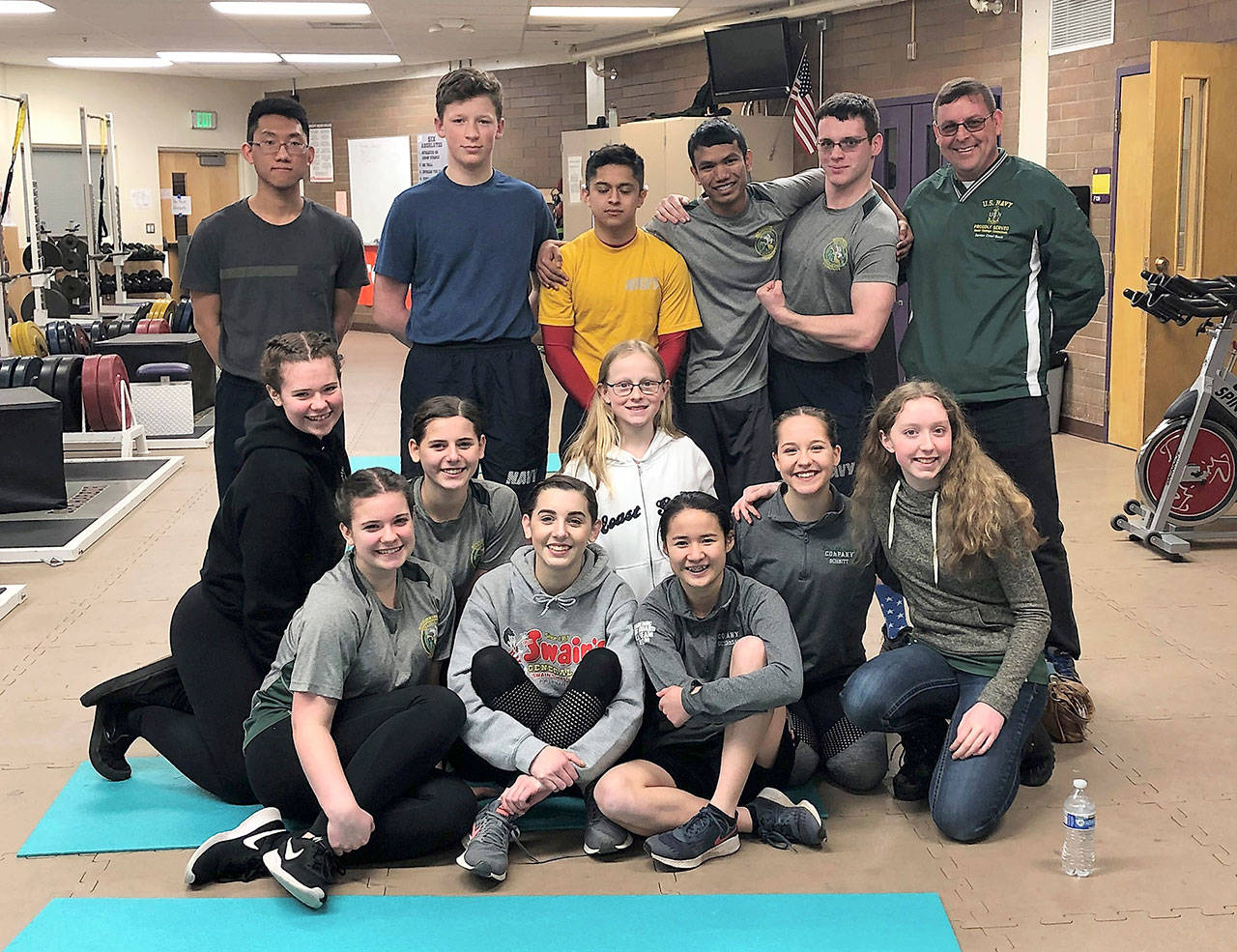 The Port Angeles High School Navy Junior Reserve Officer Training Corps Physical Strength Team includes, back row, from left, Daihan Son, William Rife, Lici Dominguez, Raynan Mani, Dakota Manley and Senior Chief Justin Beck; middle row, from left, Betty Cameron, Clara Murphy, Kendra Hiigel, Kiara Schmitt and Ellie Hiigel; and front row, from left, Sarah Cameron, Emma Murphy and Kathryn Guttormsen.