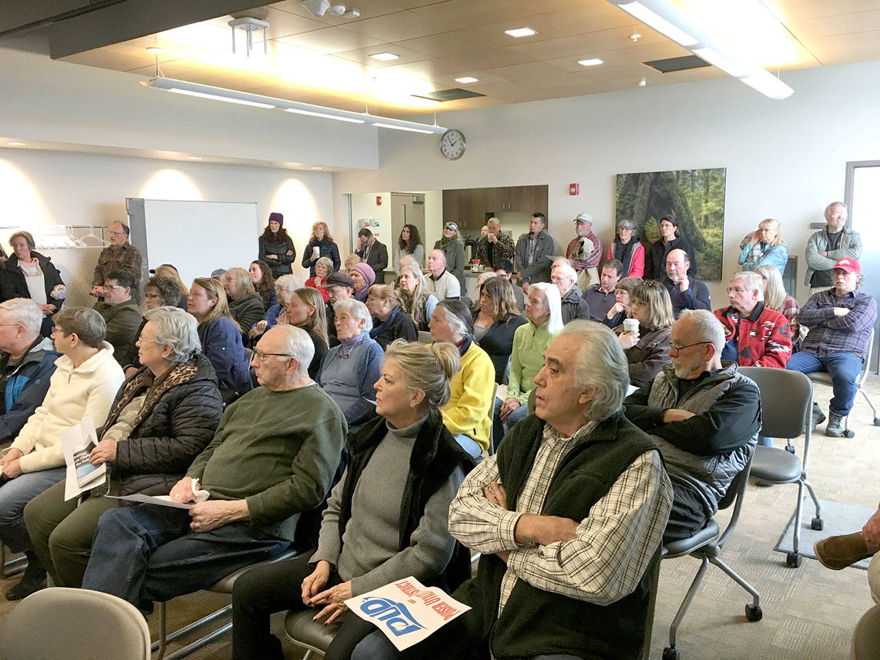 Audience members listen to a discussion on the Clallam County Public Utility District’s residential meter policy Monday at the PUD headquarters in Carlsborg. (Rob Ollikainen/Peninsula Daily News)