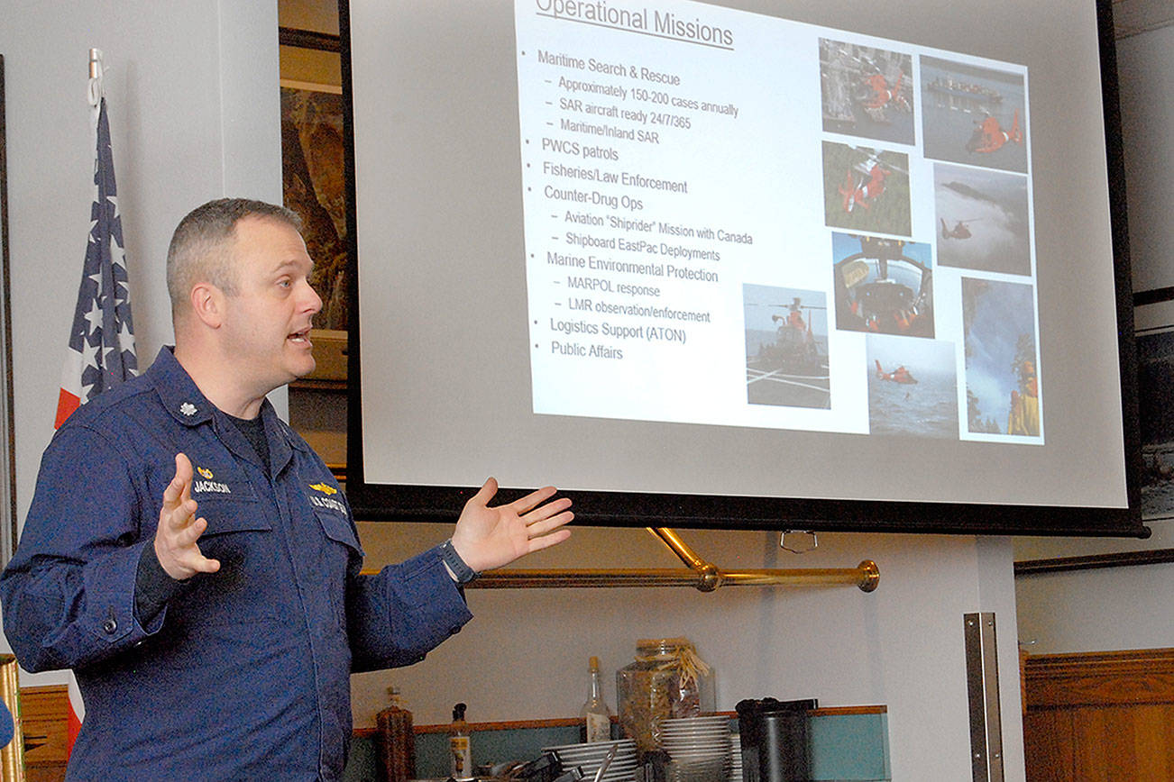 Keith Thorpe/Peninsula Daily News Cmdr. Scott Jackson, commanding officer of U.S. Coast Guard Air Station/Sector Field Office Port Angeles, speaks about the role of the Coast Guard during a Thursday luncheon with the Kiwanis Club of Port Angeles.