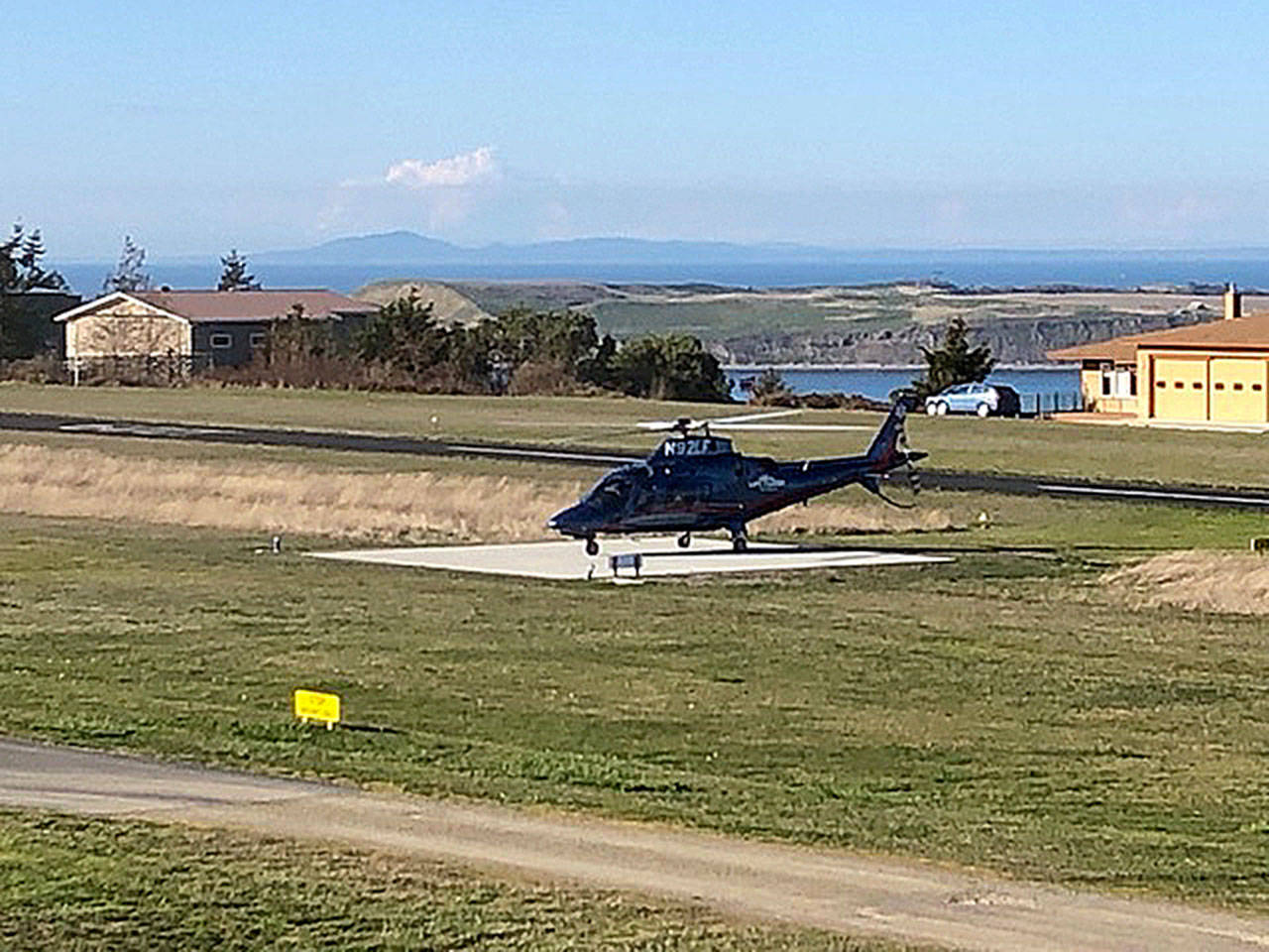 A helicopter prepares to transport a Diamond Point resident who fell from a ladder. Officials with Harborview Medical Center said the man died a day later.