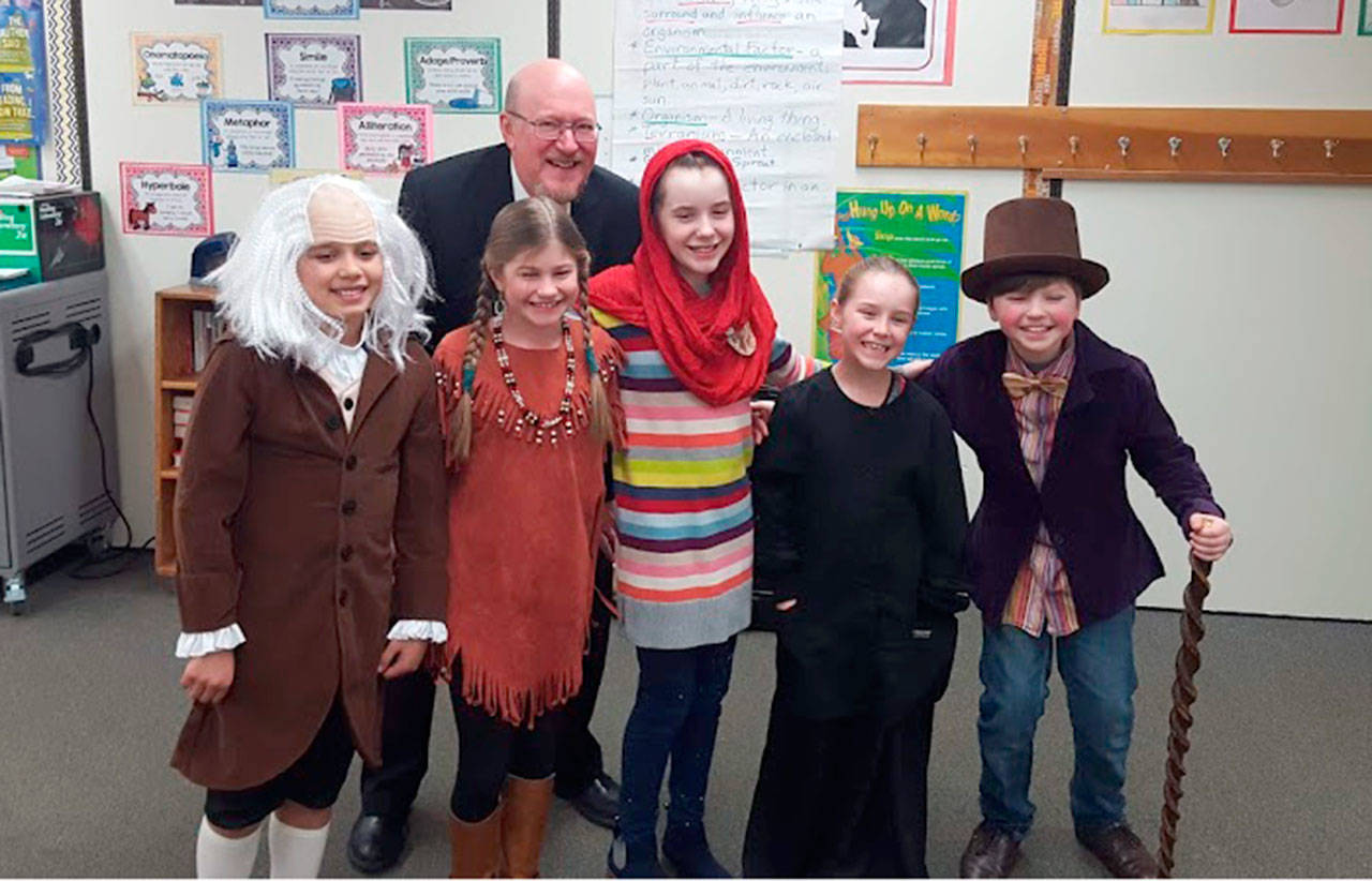 Fourth-grade students from Hamilton Elementary School, dressed as the historic figures they researched are, from left, Hudson Payne as Benjamin Franklin, Taylor Lester as Sacagawea, Hannah Hairell as Malalla, Addison Fox as Marie Curie and Boston Pietrafeso as Roald Dahl. In the back is teacher and Night of the Notables host, Trent Pomeroy. (Andrea Pietrafeso/Port Angeles School District)