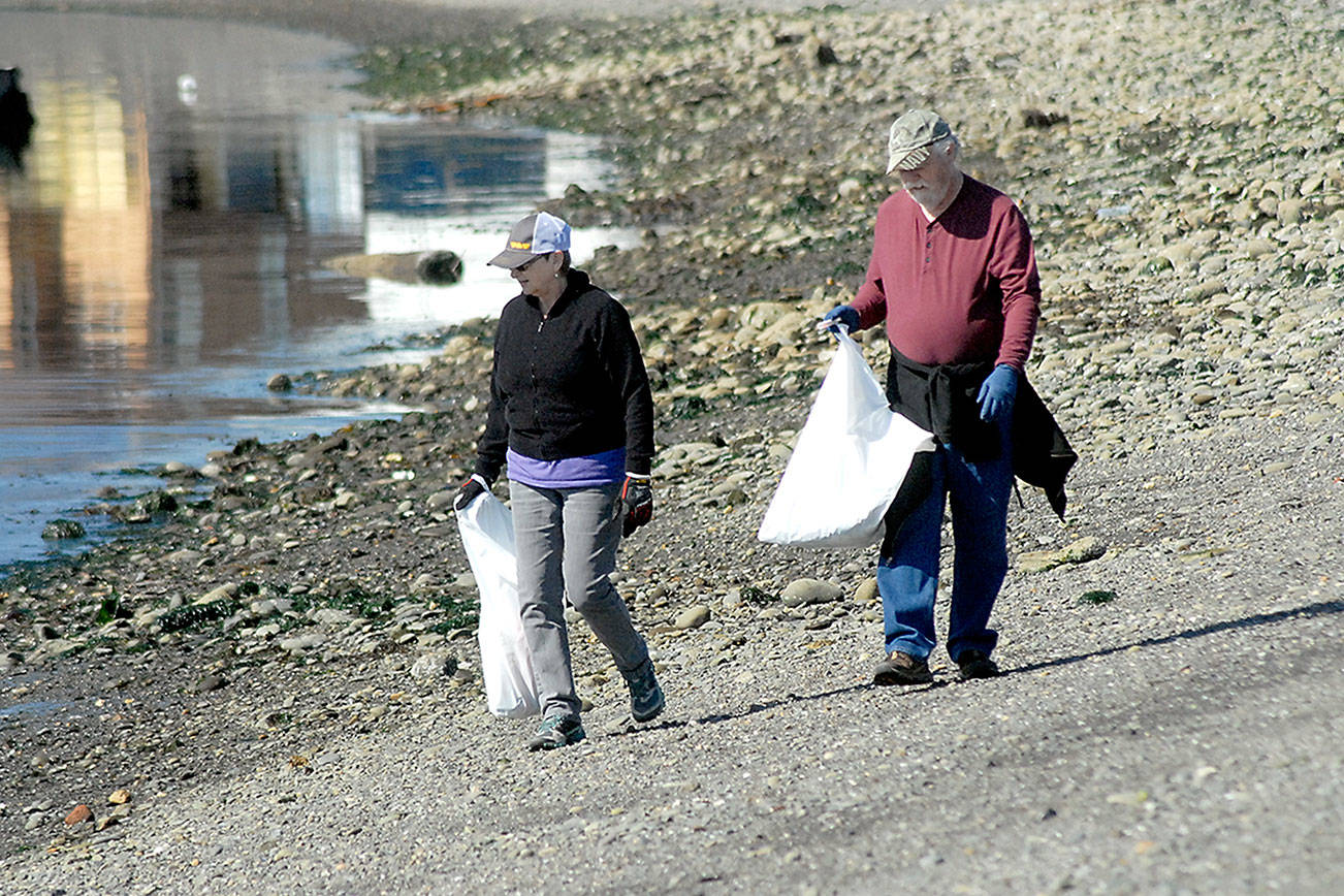 PHOTO: Volunteers search for debris on Peninsula beaches