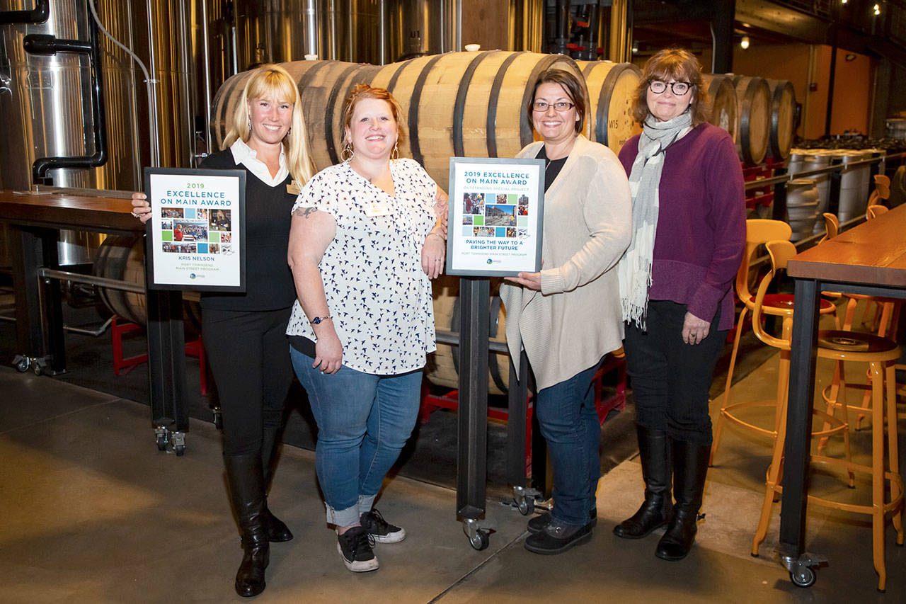 Members of the Port Townsend Main Street program, from left, are board President Kris Nelson, board member Amber Bartl, event assistant Candace Mangold Executive Director Mari Mullen. (C.B. Bell/The Washington Trust for Historic Preservation)