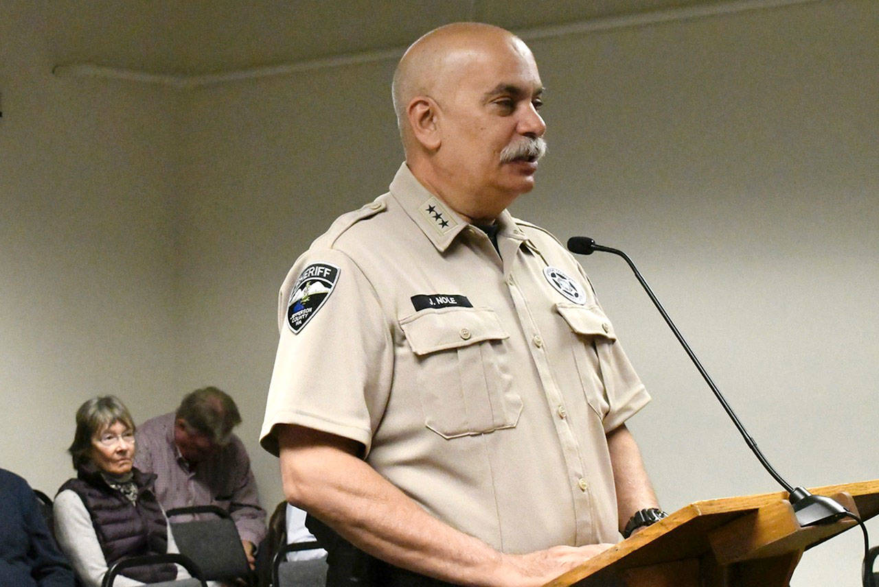 Jefferson County Sheriff Joe Nole accepts the county commissioners’ proclamation making the week of May 12 National Police Week and May 15 as Peace Officers’ Memorial Day. (Jeannie McMacken/Peninsula Daily News)