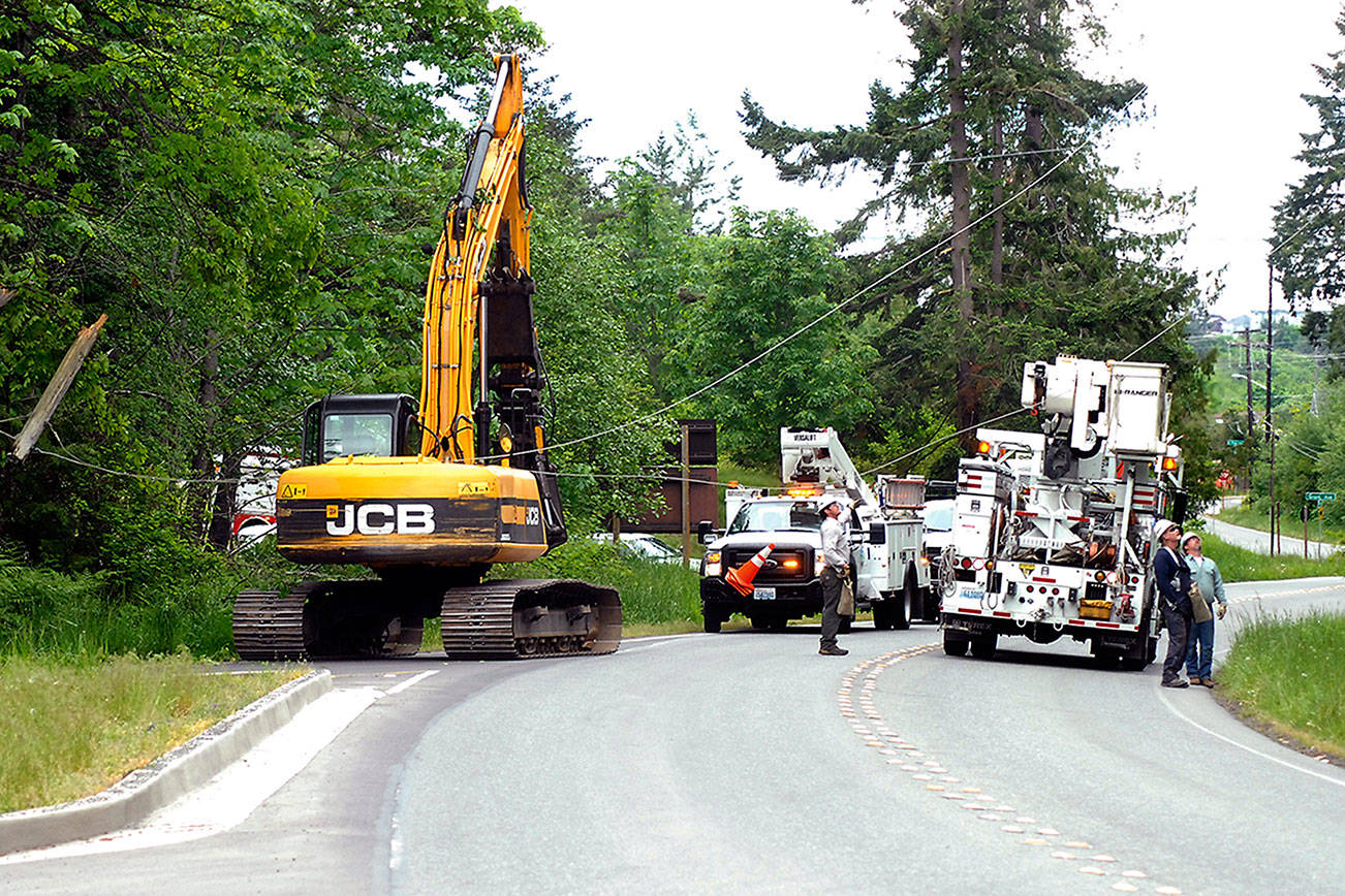 PHOTO: Excavator caught on a wire snags lines in Port Angeles