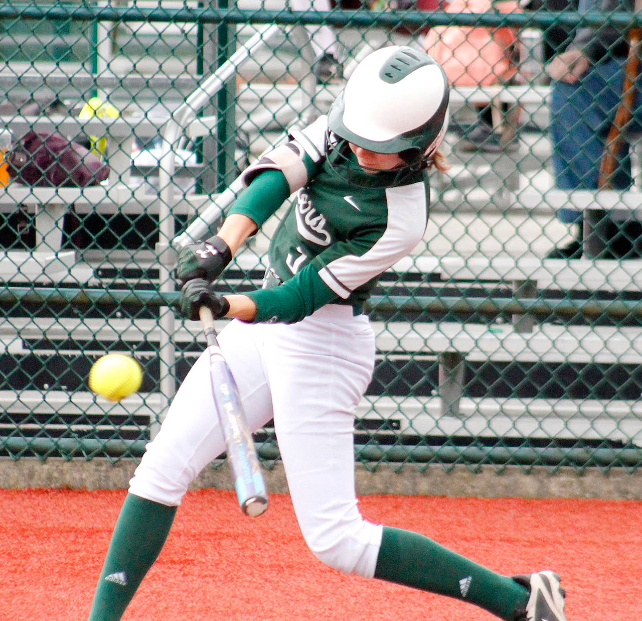 Port Angeles’ Zoe Smithson barrels up bat to ball for a hit during the Roughriders’ 15-6 district win over Fife on Friday at the Regional Athletic Center in Lacey. Port Angeles qualified for state with the win.                                Mark Krulish/Kitsap News Group