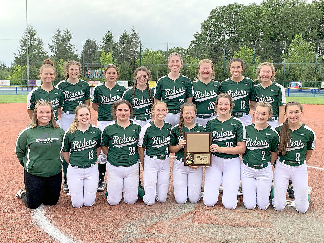 The Port Angeles softball team celebrates its WCD III 2A championship Saturday at Lacey. The Roughriders begin play at the state 2A tournament Friday.