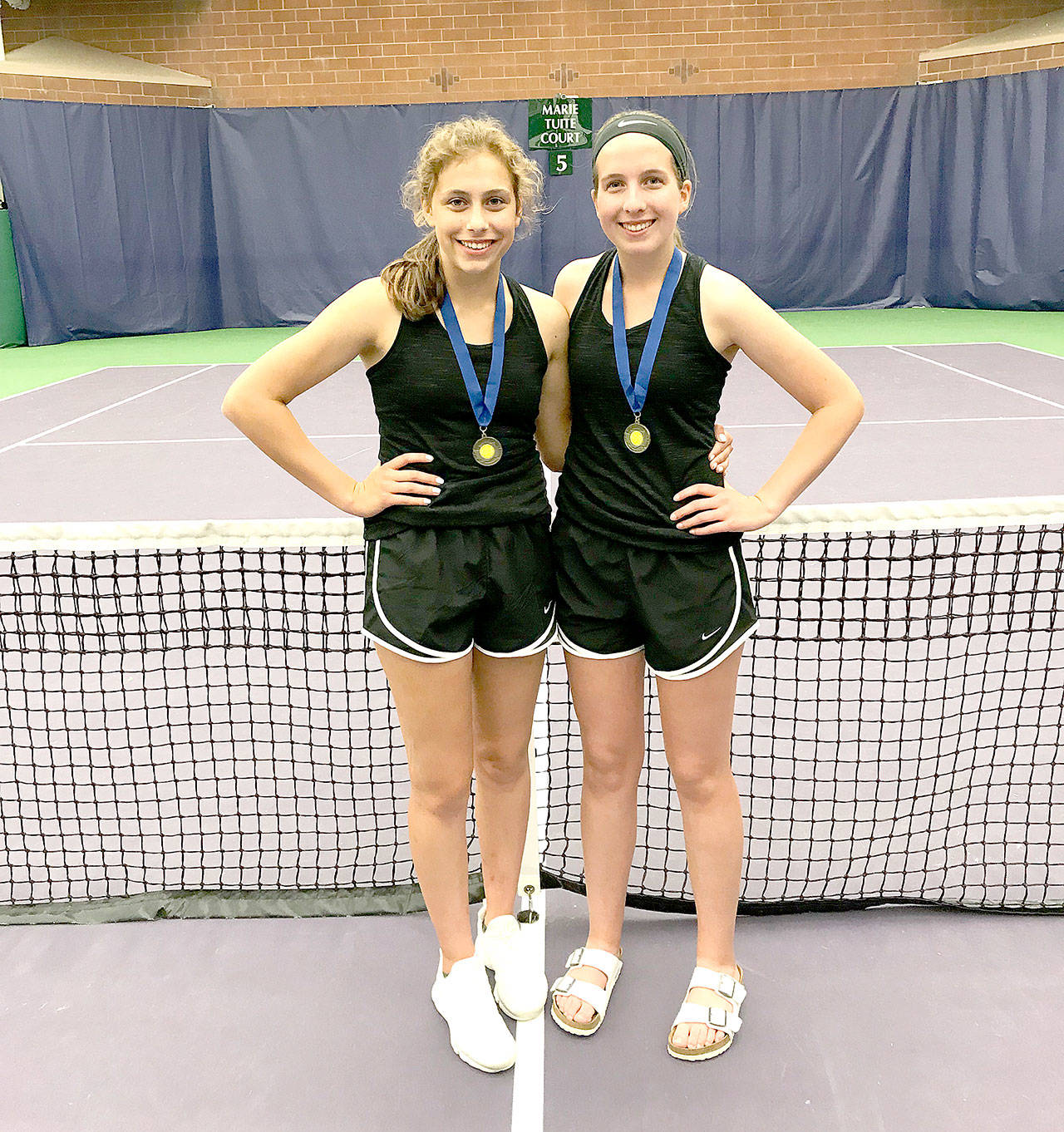 Sequim’s Jessica Dietzman, left, and Kalli Wiker are the state 2A girls doubles tennis champions after beating Nina Vongslay and Katrina Kuntz of Sammamish 6-7, 6-2, 6-1 Saturday in the championship match at the Nordstrom Tennis Center in Seattle.