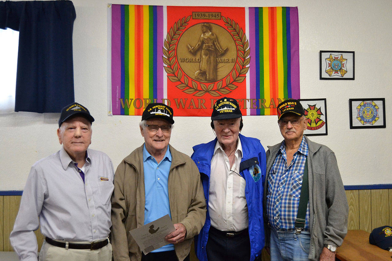 To honor the 75th anniversary of D-Day, four World War II veterans, from left, Claude Giles, Lee Cox, Robert “Bob” Barbee, and Art Bradow, attended the event at the Sequim VFW Post 4760. (Matthew Nash/Olympic Peninsula News Group)