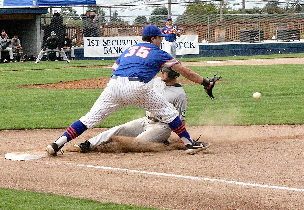 Dave Logan/for Peninsula Daily News Lefties first baseman C.J. Shauwecker, left, reaches for a throw from Port Angeles right fielder Nick DiPonzio to double up Yakima Valley’s Noah Andrews and record the second out of a double play Tuesday night at Civic Field.