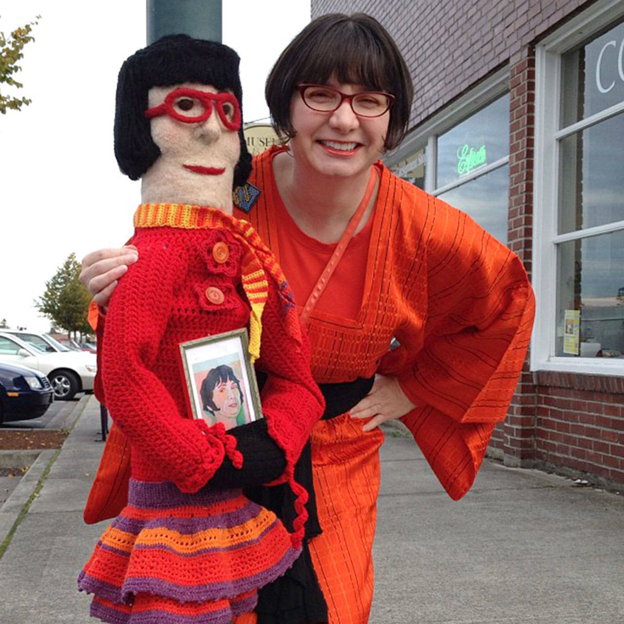 Renne Emiko Brock, director of the 14th annual North Olympic Fiber Arts Festival Exhibition, poses with her creation.