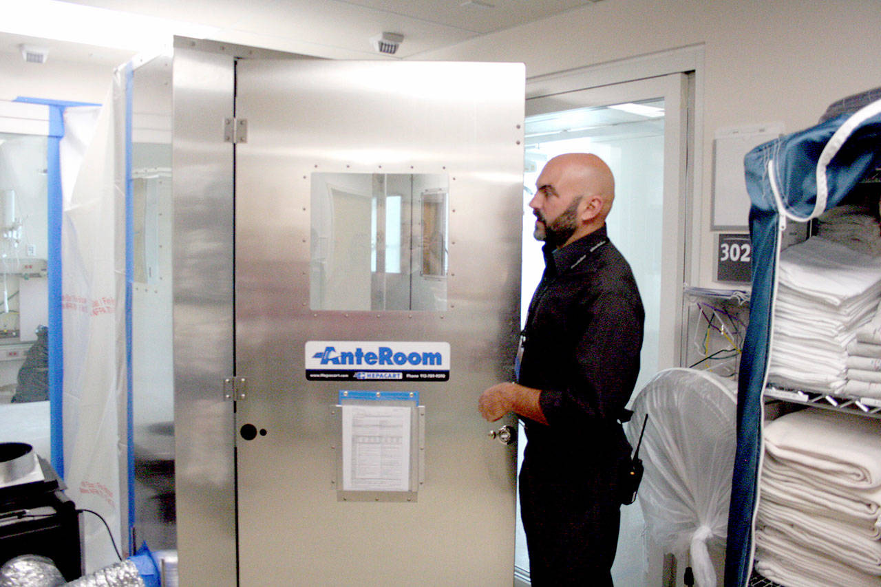 Aaron Vallat, the construction and planning manager for Jefferson Healthcare Medical Center, prepares to walk through an AnteRoom, which seals individual rooms while construction takes place inside. The Jefferson Healthcare Foundation received a $100,000 grant from the First Federal Community Foundation to renovate six inpatient rooms at the hospital. (Brian McLean/Peninsula Daily News)