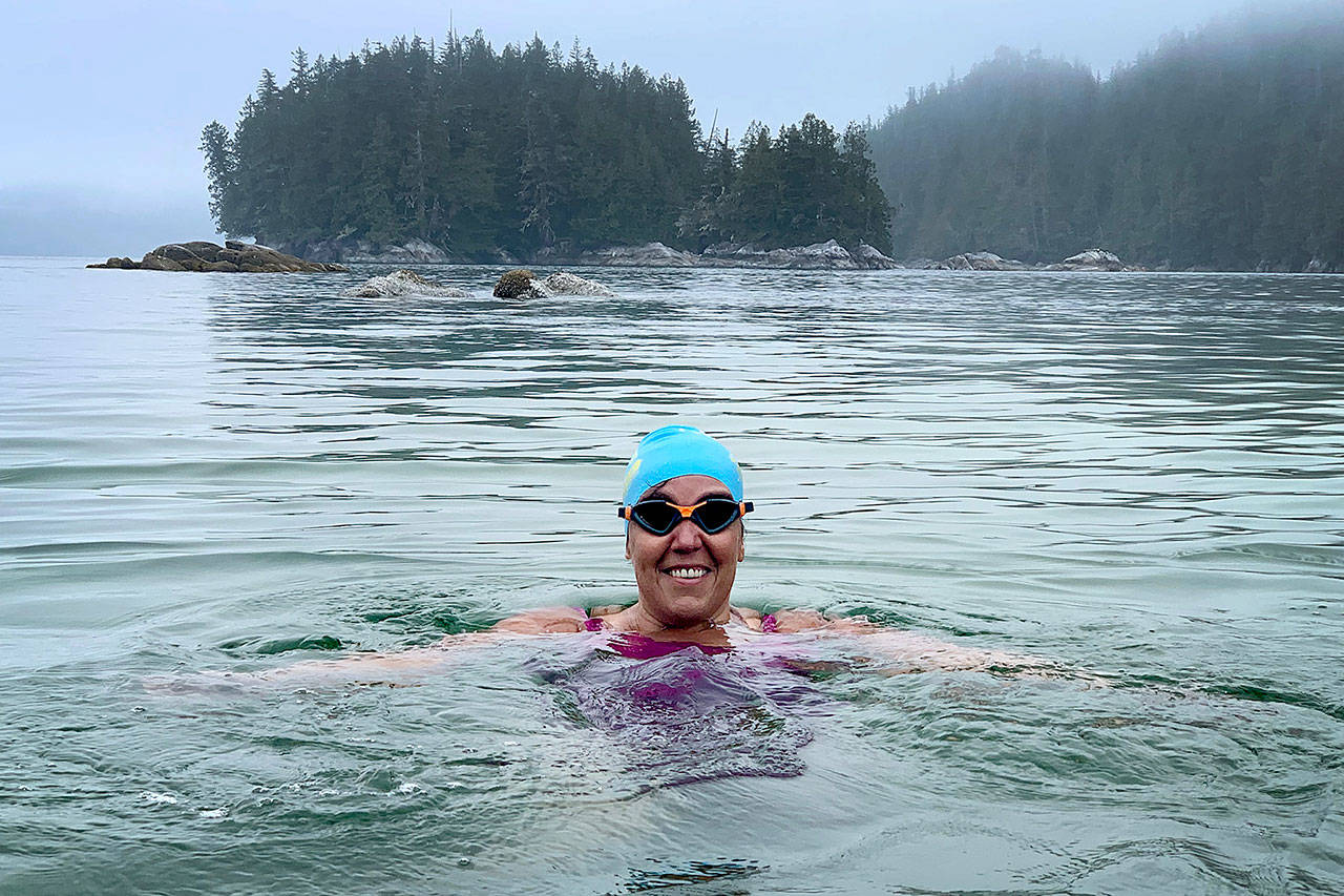 Susan Simmons swims in the Koeye River in June. Her attempt to swim across the Strait of Juan de Fuca ended early Sunday after currents pushed her back. (Corey Teramura)